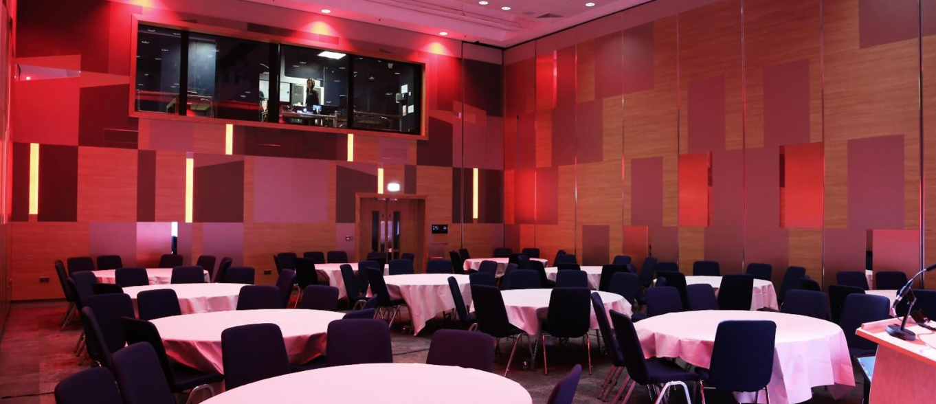 Event space in ICC Birmingham with pink table linens for banquets and conferences.