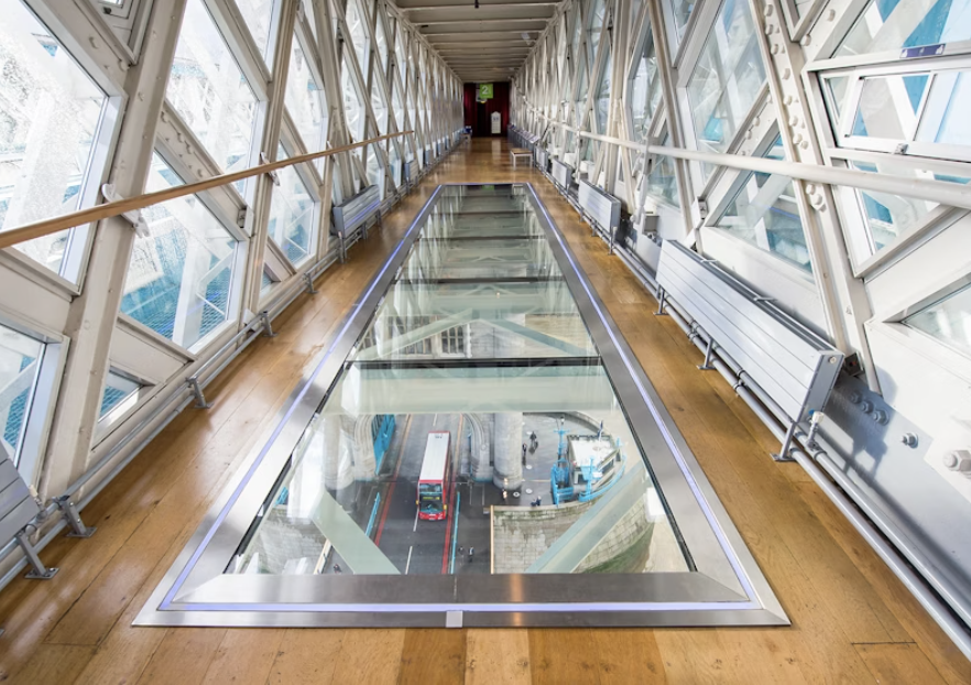 Modern glass walkway at Tower of London, ideal for event networking and unique experiences.