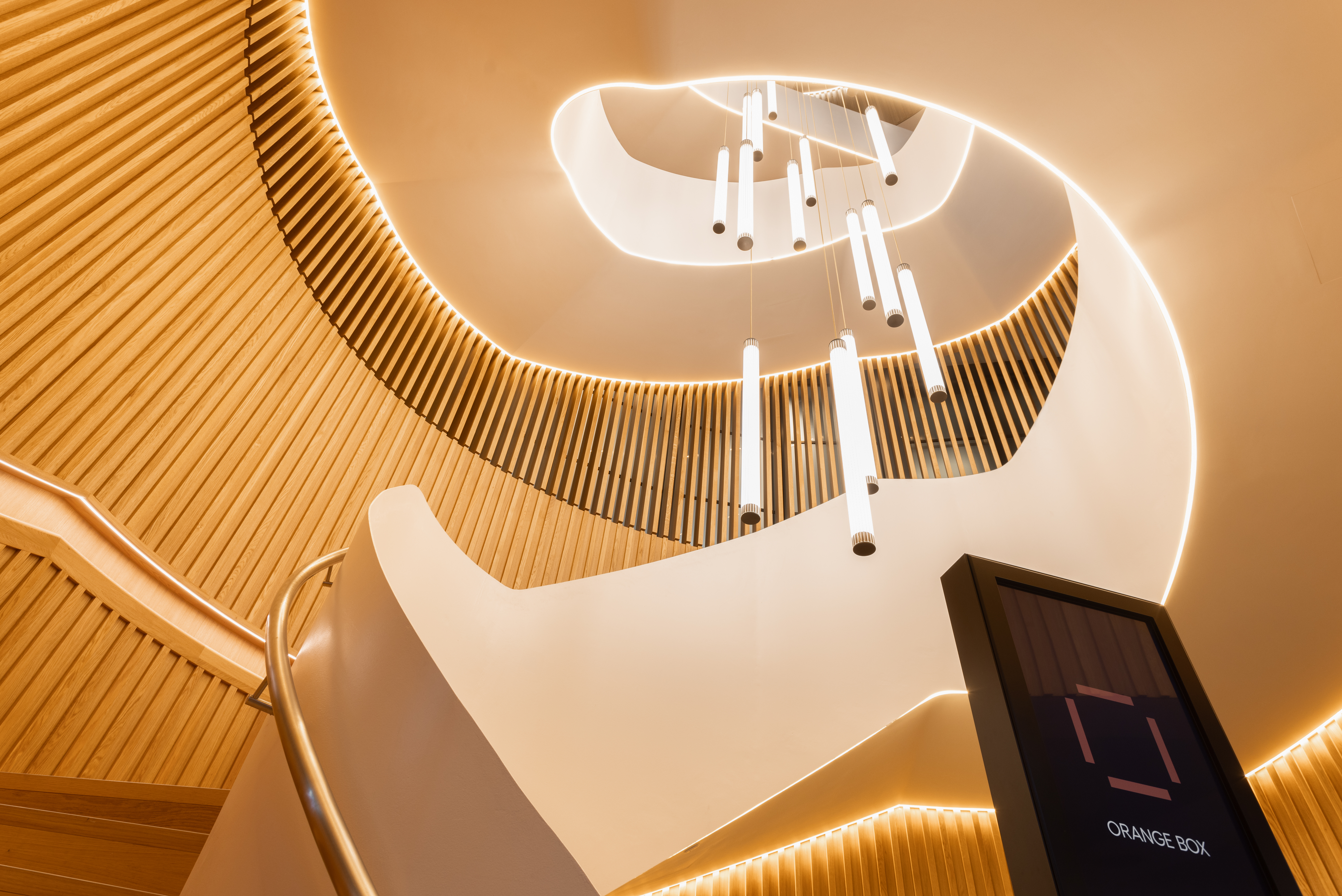 "Modern staircase at Orange Box, Fulham Pier, ideal for upscale events and networking."