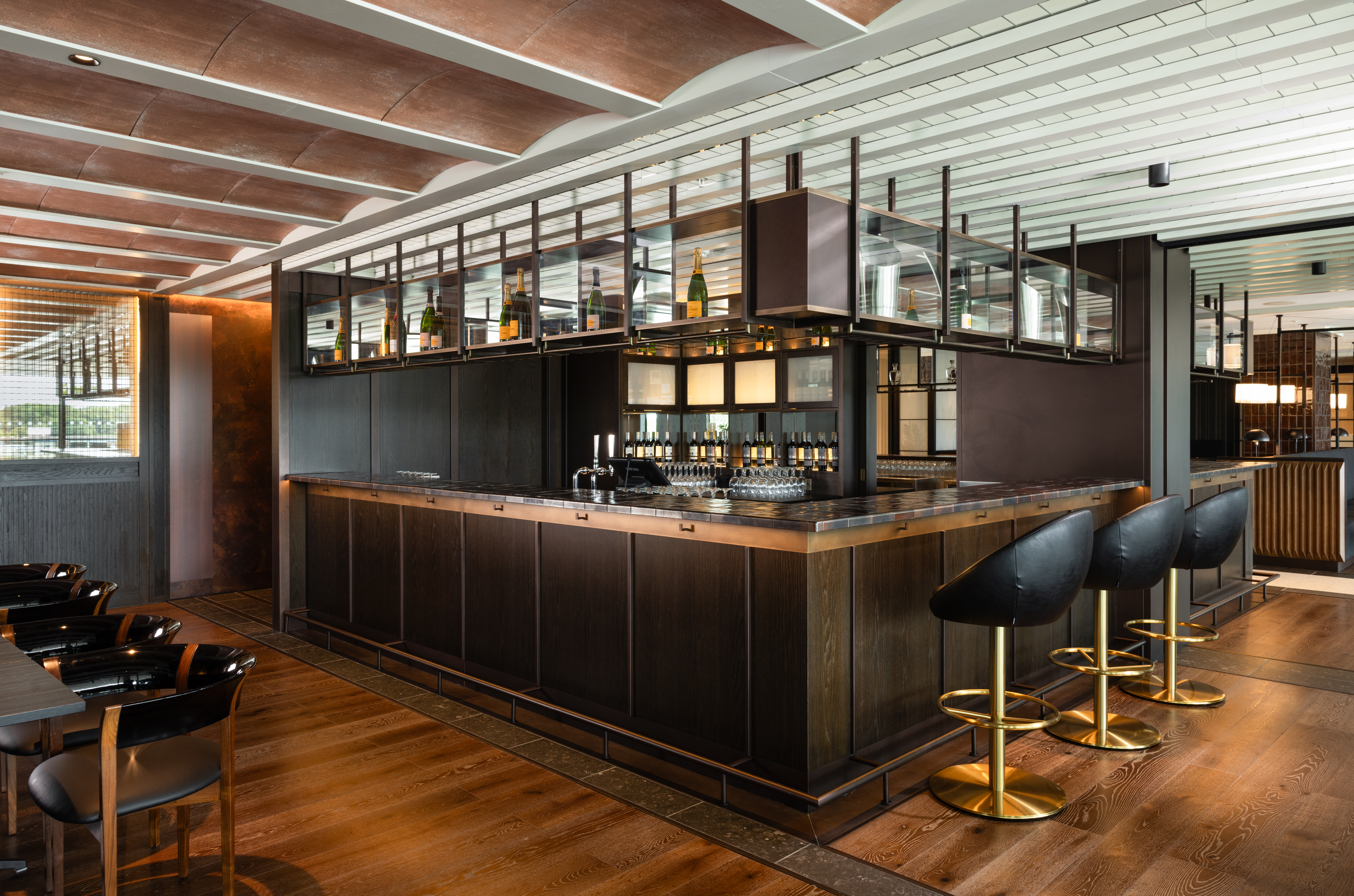 Sleek modern bar at Water's Edge, Fulham Pier for networking and cocktail receptions.