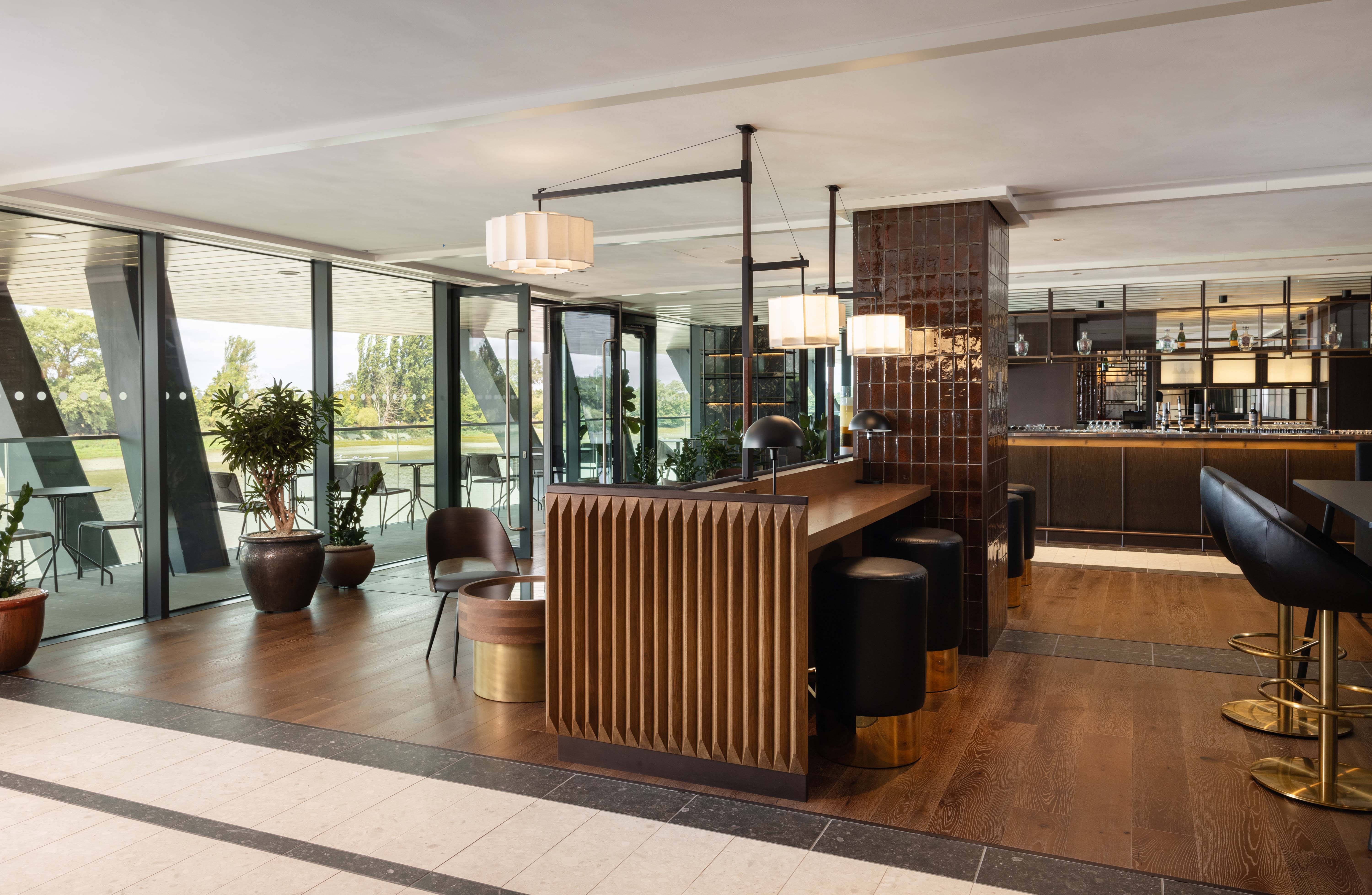 Modern meeting space at Water's Edge, Fulham Pier, ideal for networking events.