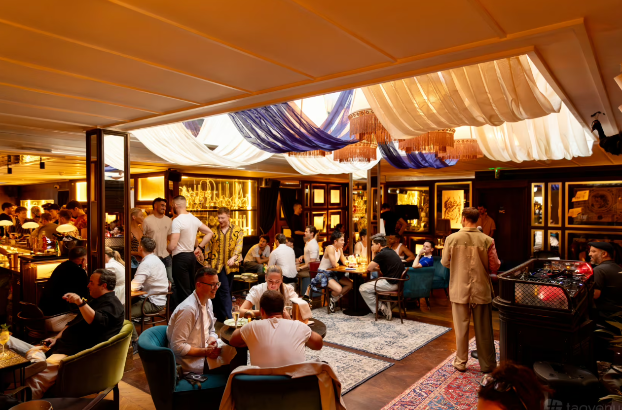 Vibrant networking venue in Backstage Soho with elegant decor and warm lighting.