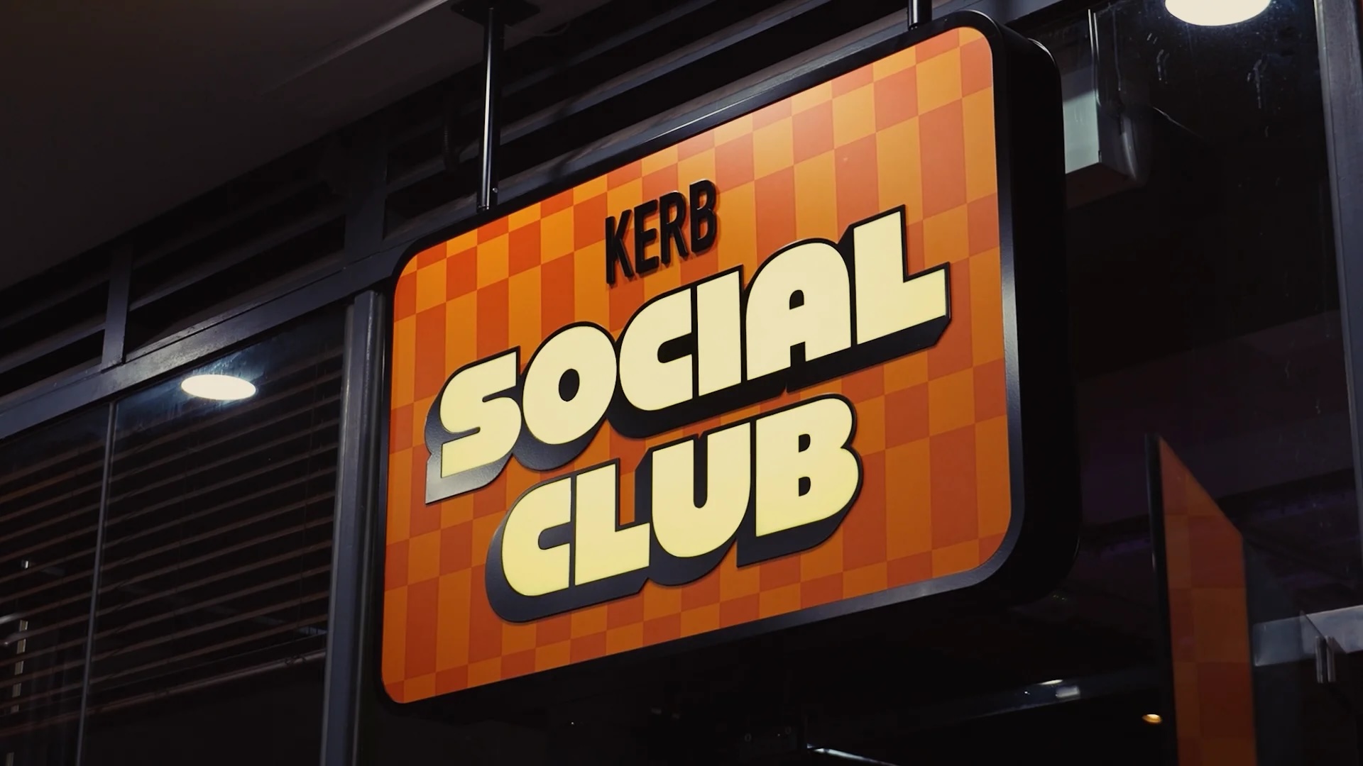 "KERB Social Club vibrant sign, trendy venue for networking and social events"