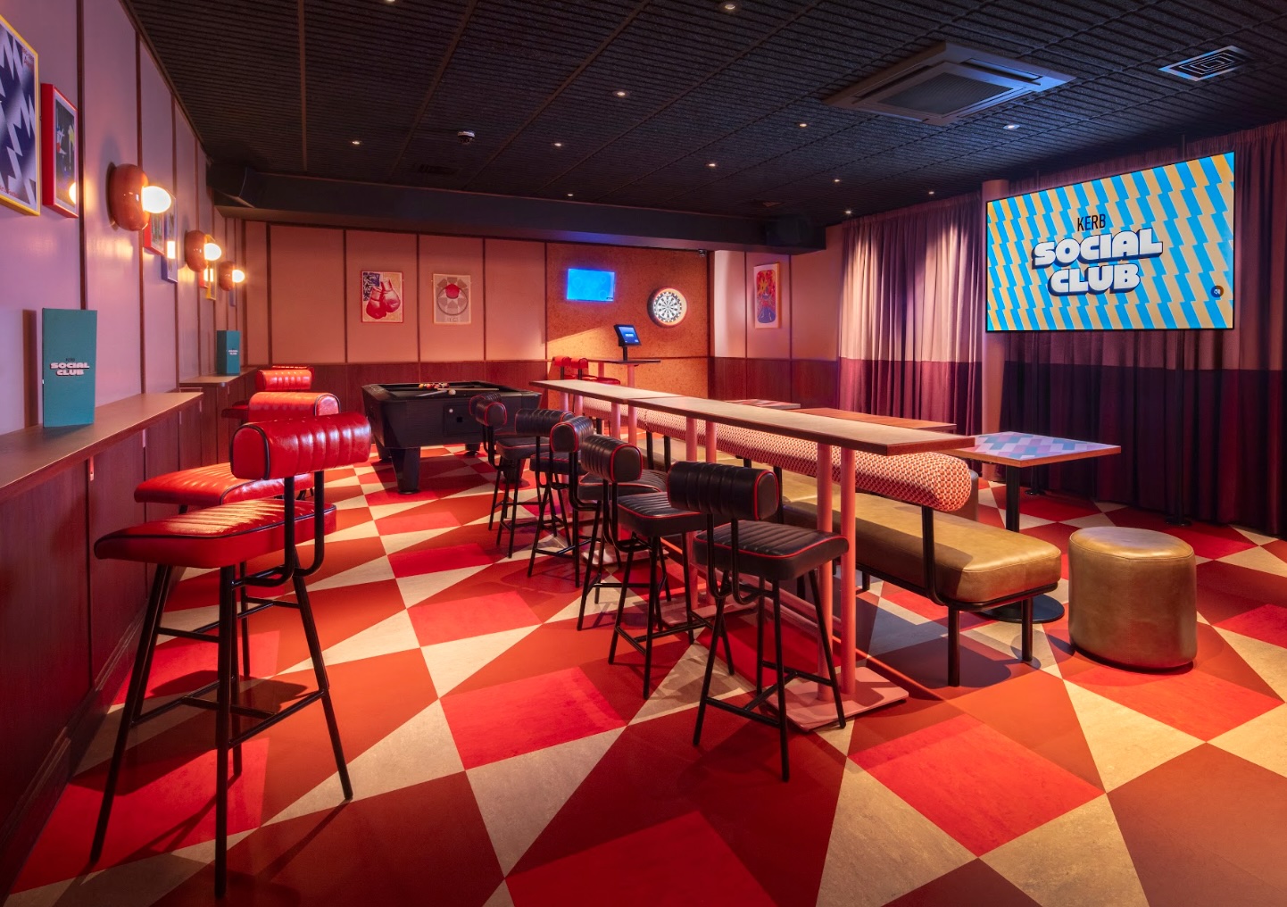 Vibrant event space with cozy seating at KERB Social Club for meetings and gatherings.