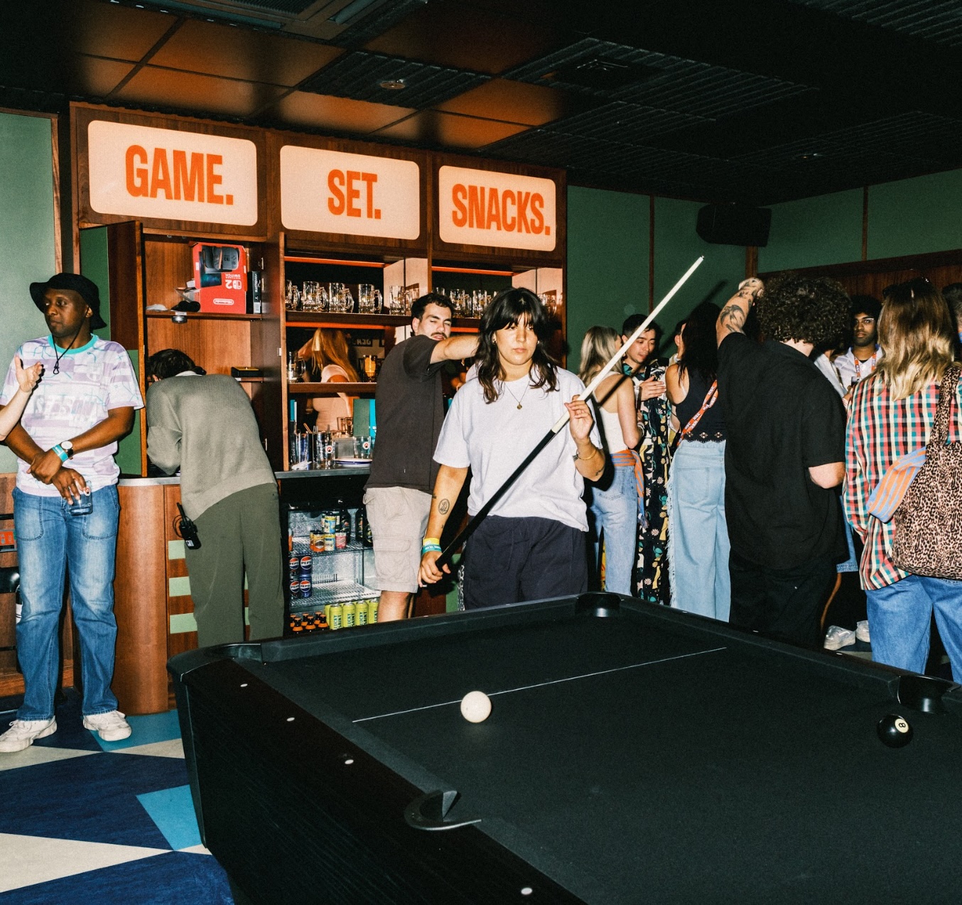 Lively event space at KERB Social Club with snacks for networking and camaraderie.