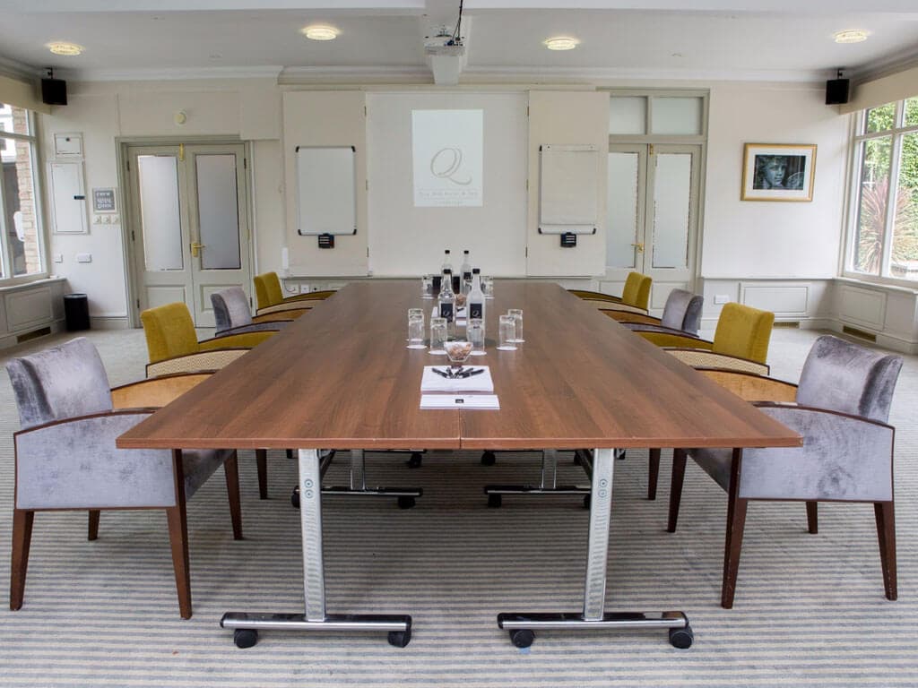 Boardroom setup in The Garden Room at Quy Mill Hotel, perfect for professional corporate meetings.