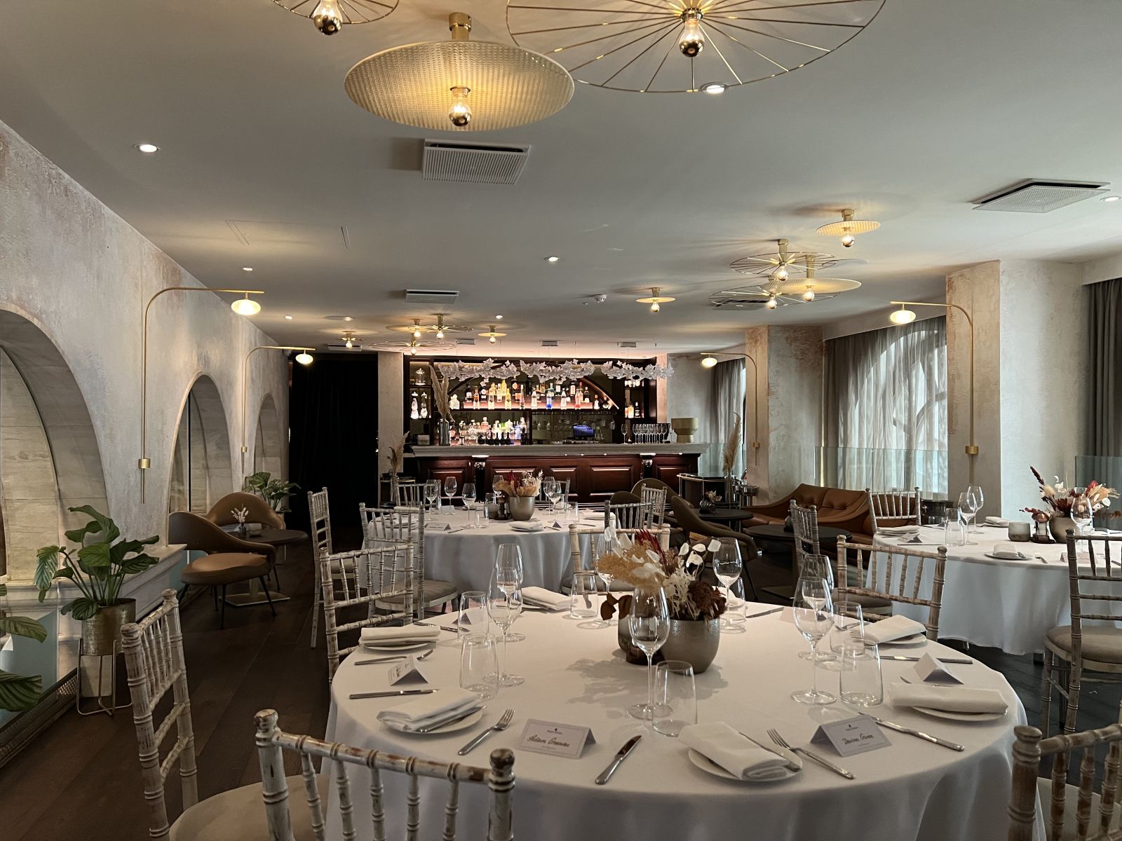 Elegant dining space with round tables for corporate dinners or celebrations.