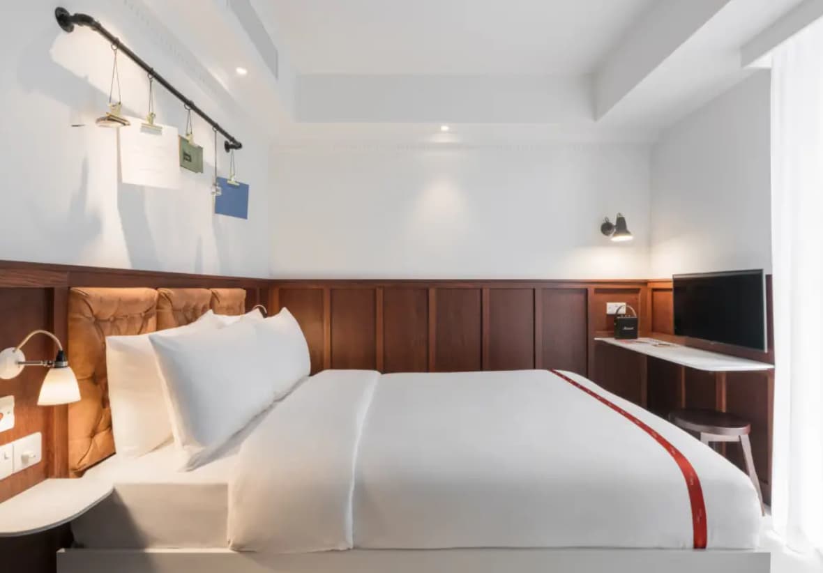 Ruby Stella Hotel room with modern decor, ideal for corporate travel and conference accommodation.