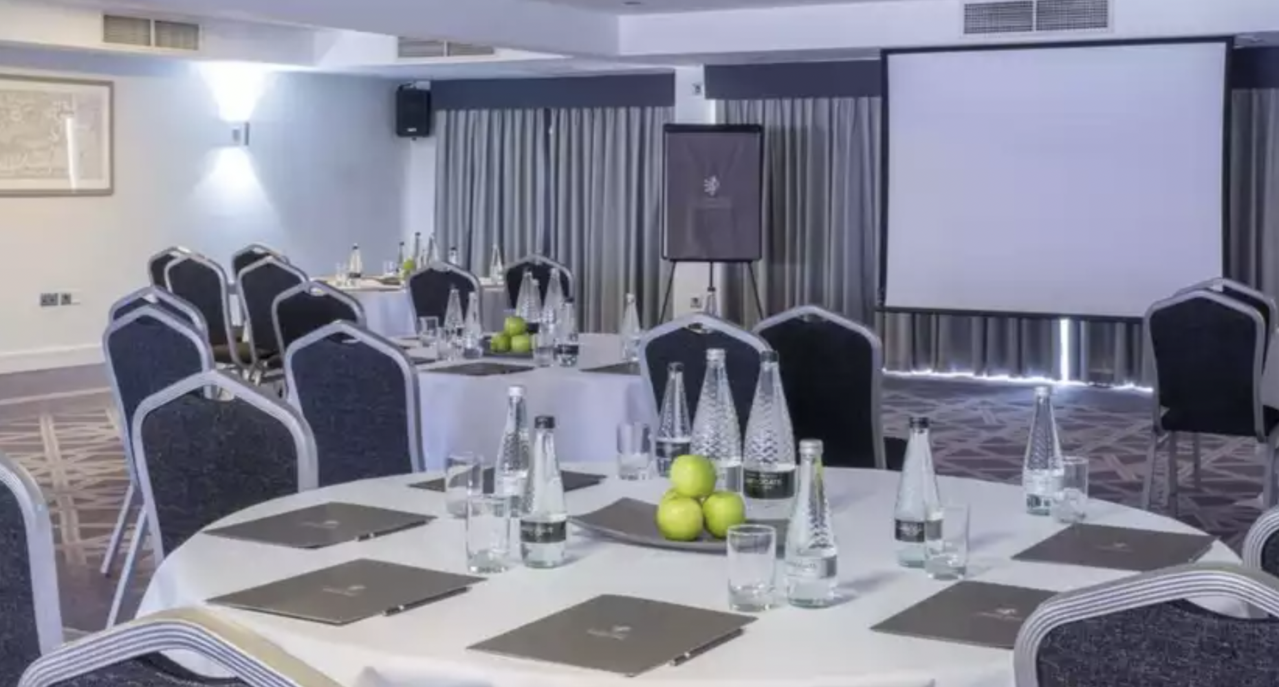 Links Suite meeting room at Formby Hall, round tables set for a professional gathering.