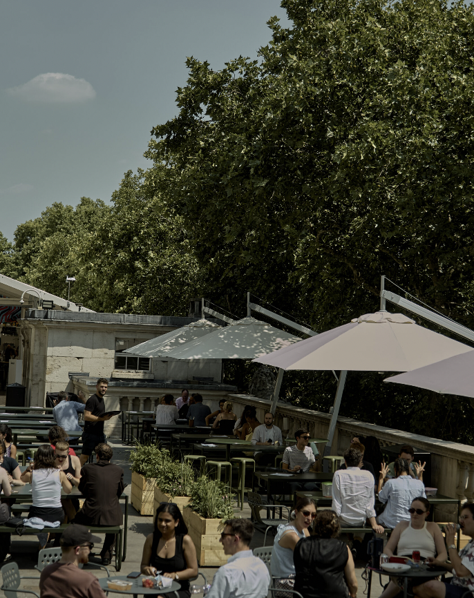 Vibrant rooftop venue for parties and private hire with inviting seating arrangements.