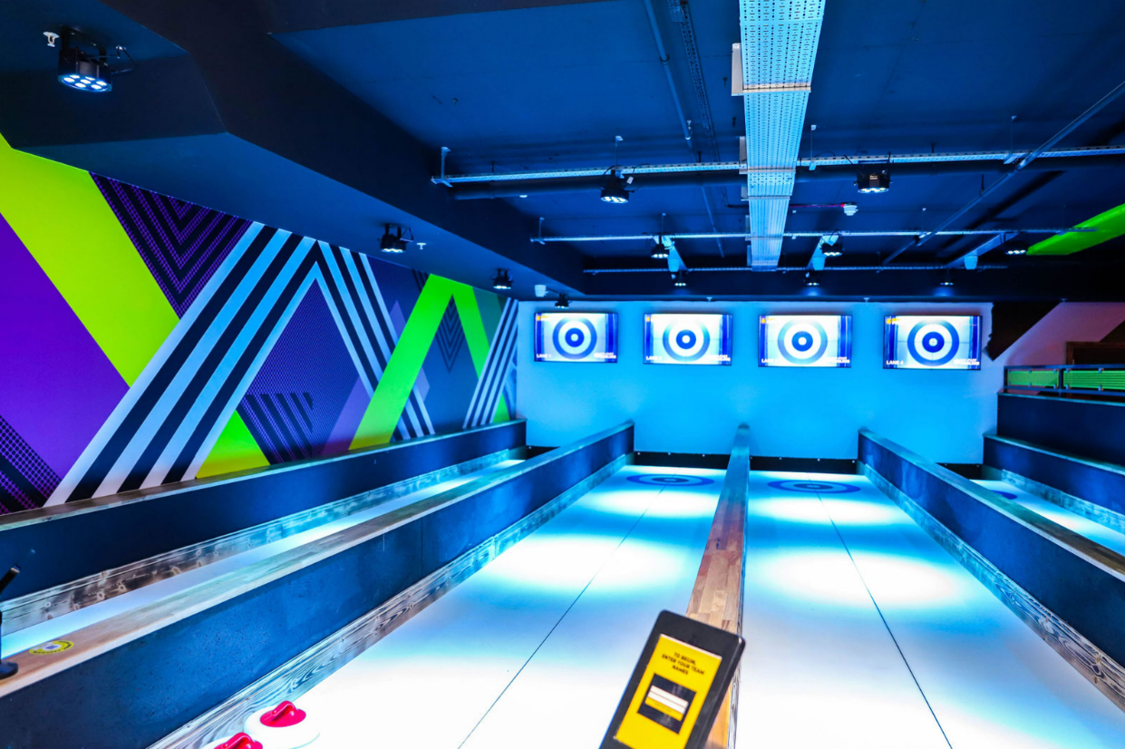 Vibrant shuffleboard event space at The Lodge, Cabot Circus, ideal for gatherings.