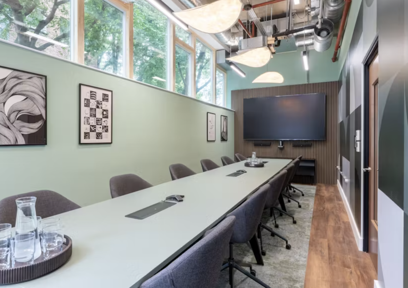 Modern meeting room with tech amenities for corporate events and presentations.