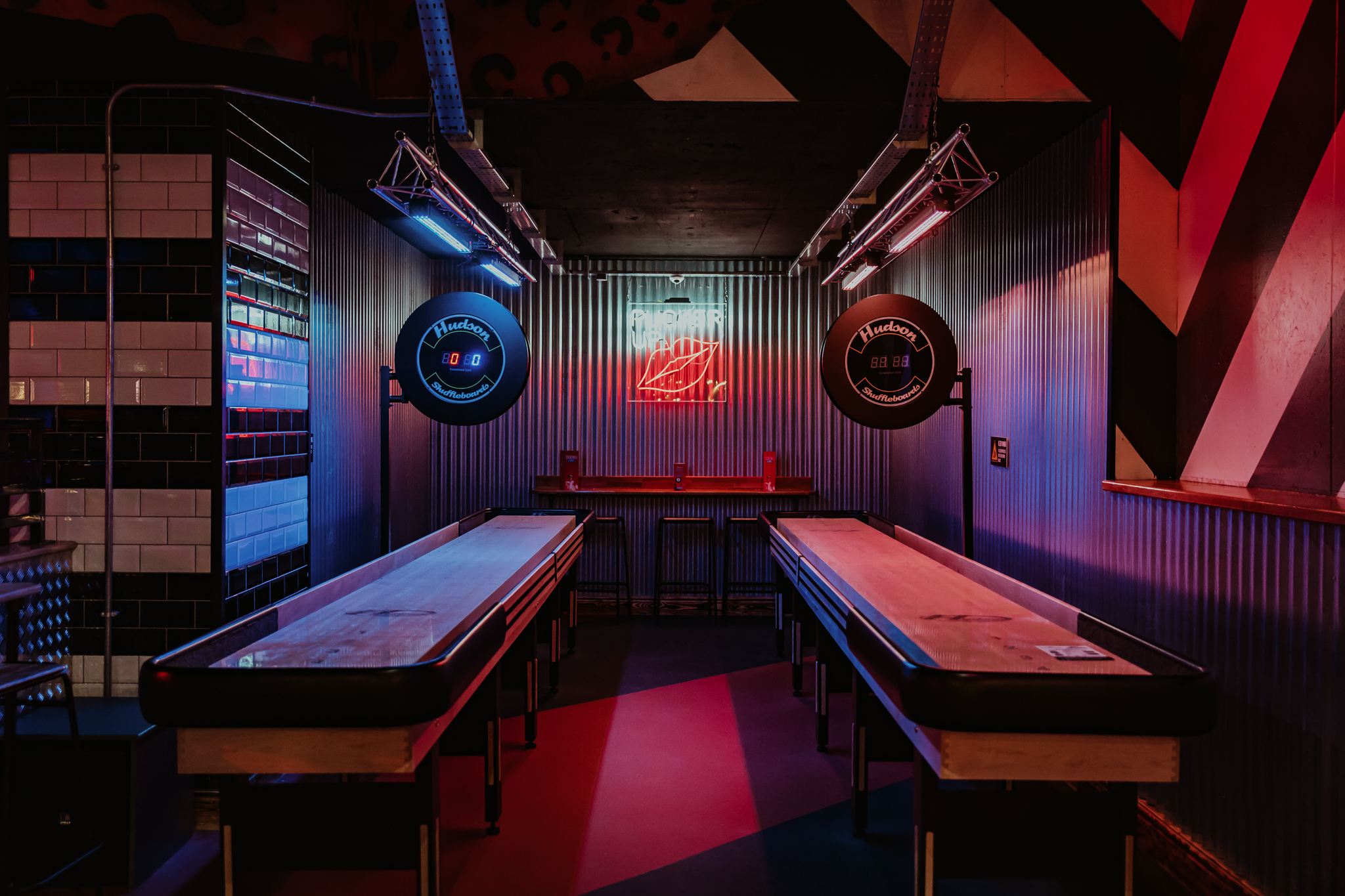 Vibrant Roxy Ball Room venue with shuffleboard, perfect for gatherings and team-building.