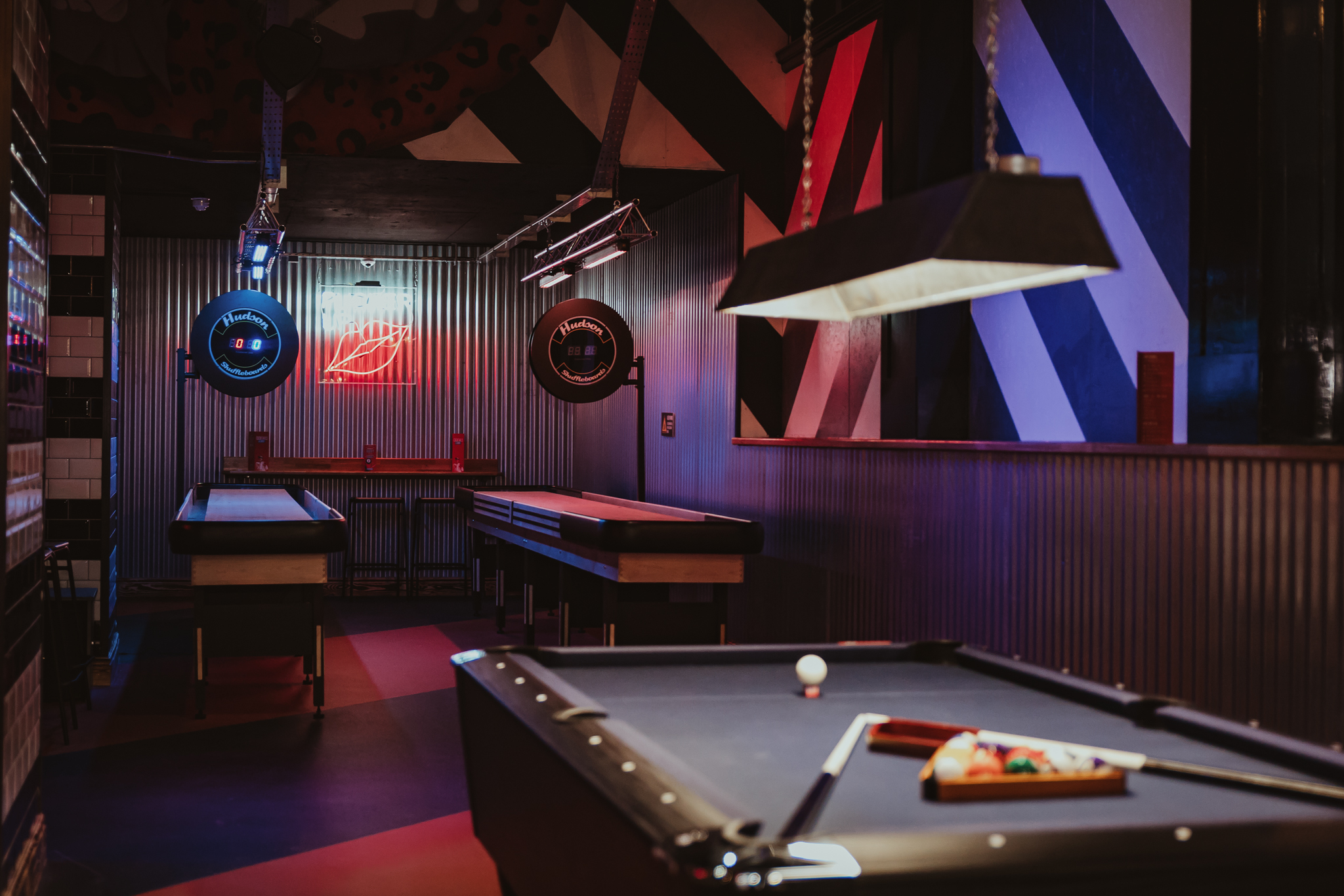 Vibrant entertainment space with pool tables for networking events in Birmingham.