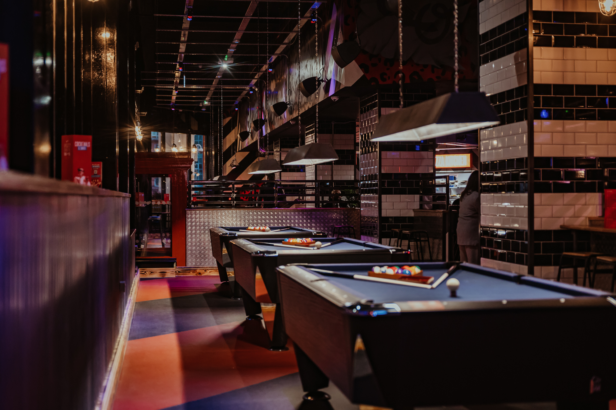 Vibrant Roxy Ball Room venue with pool tables for networking and team-building events.