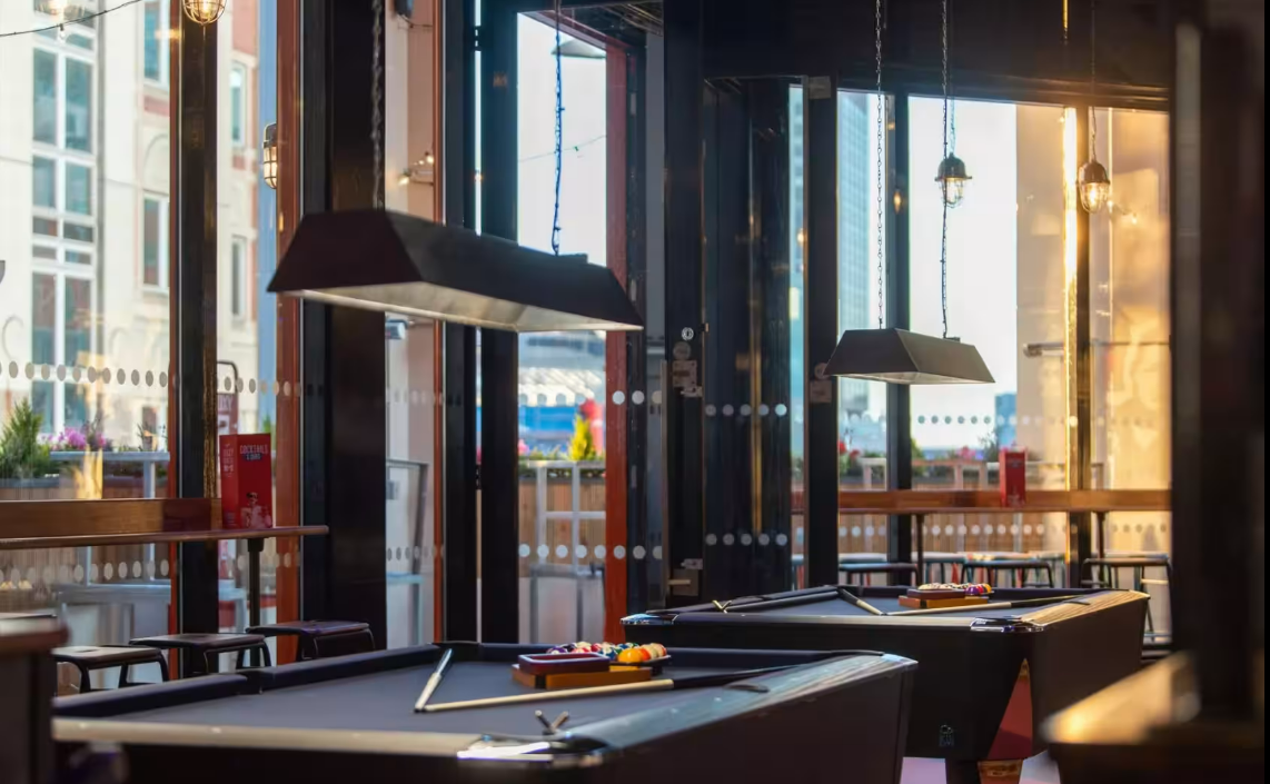 Stylish event space in Roxy Ball Room with pool tables, ideal for networking or team-building.