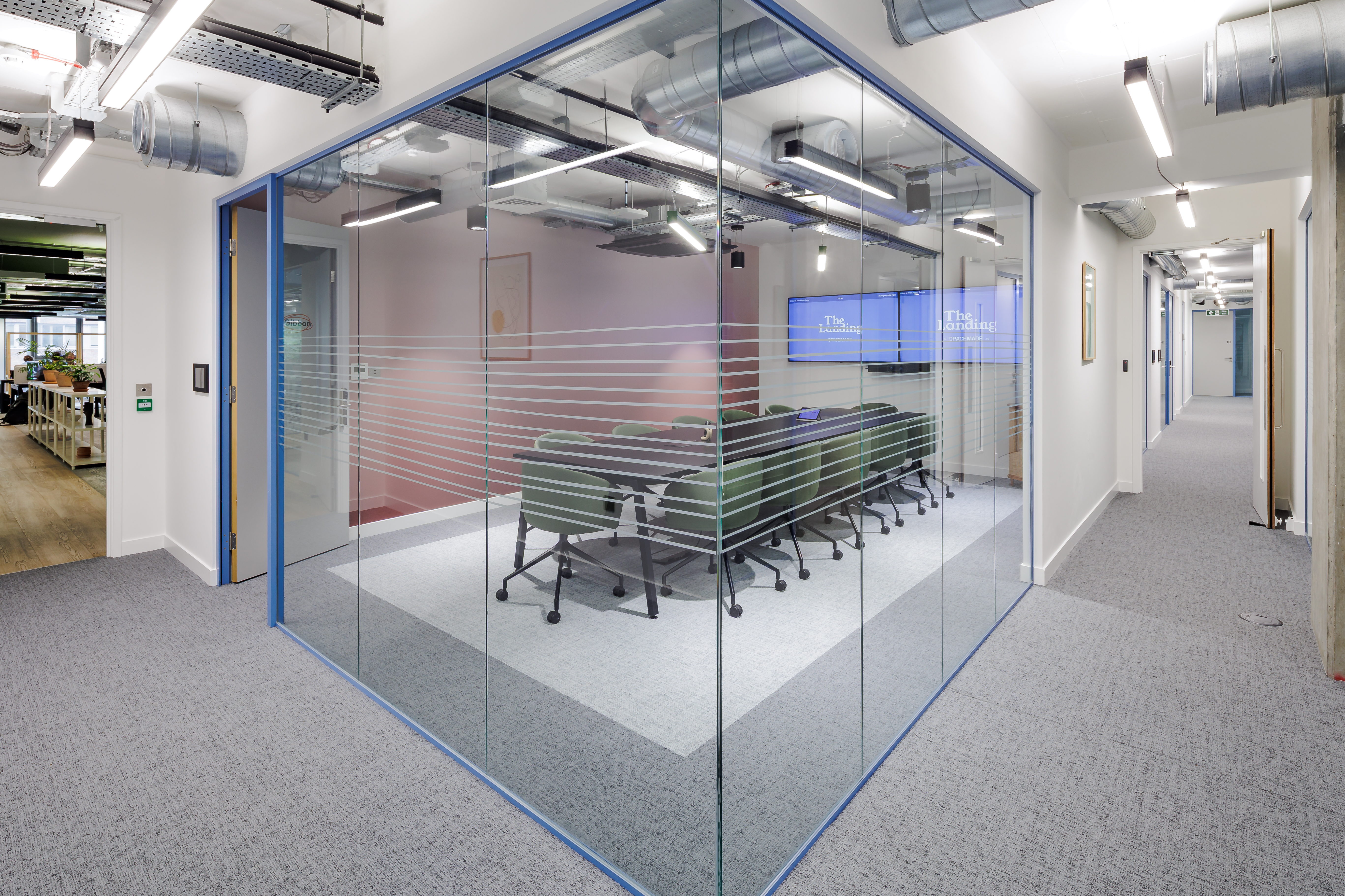 Modern Gibbon Meeting Room with glass walls for collaborative corporate events.
