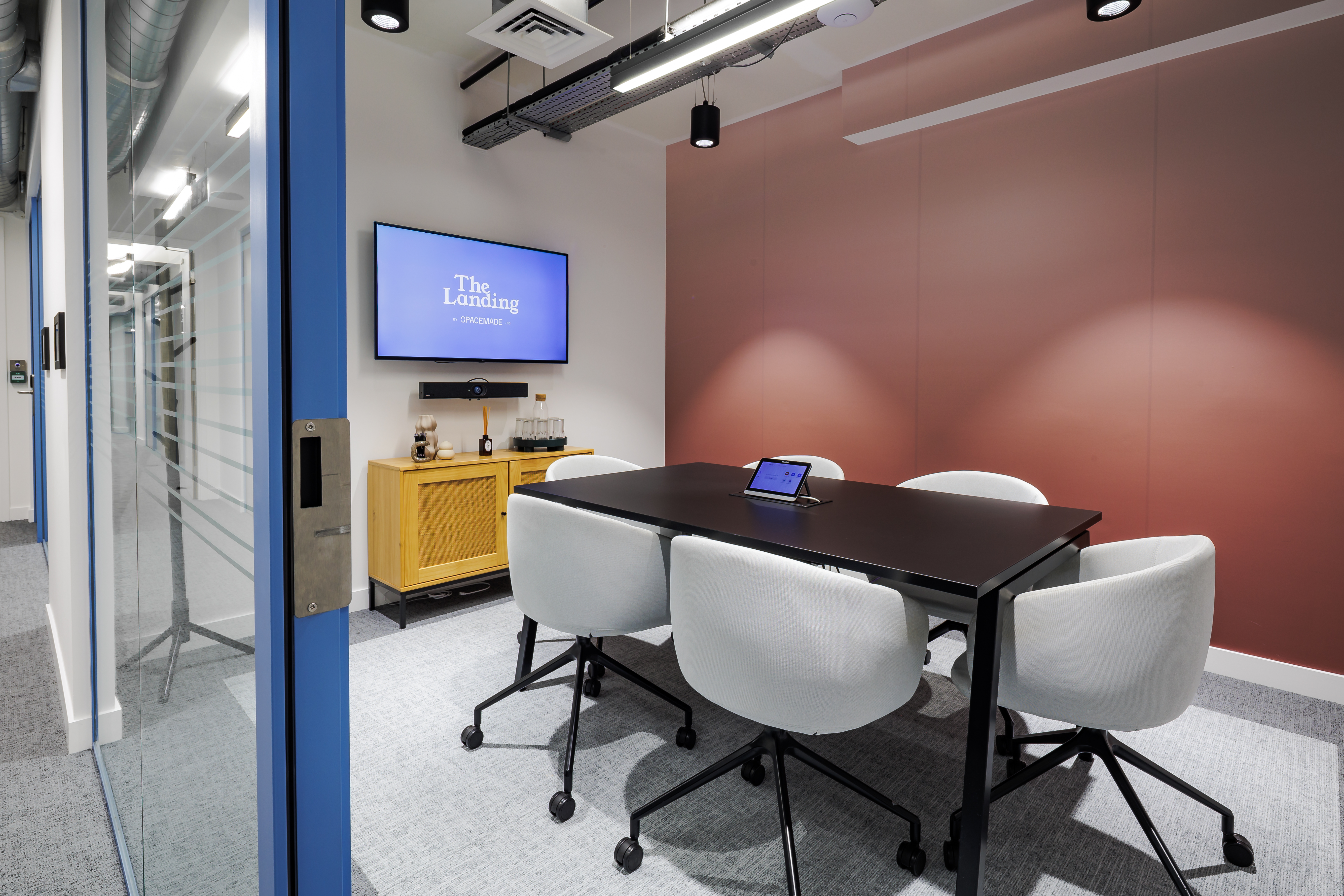 Modern Oates Meeting Room with sleek table, ideal for professional gatherings and brainstorming.