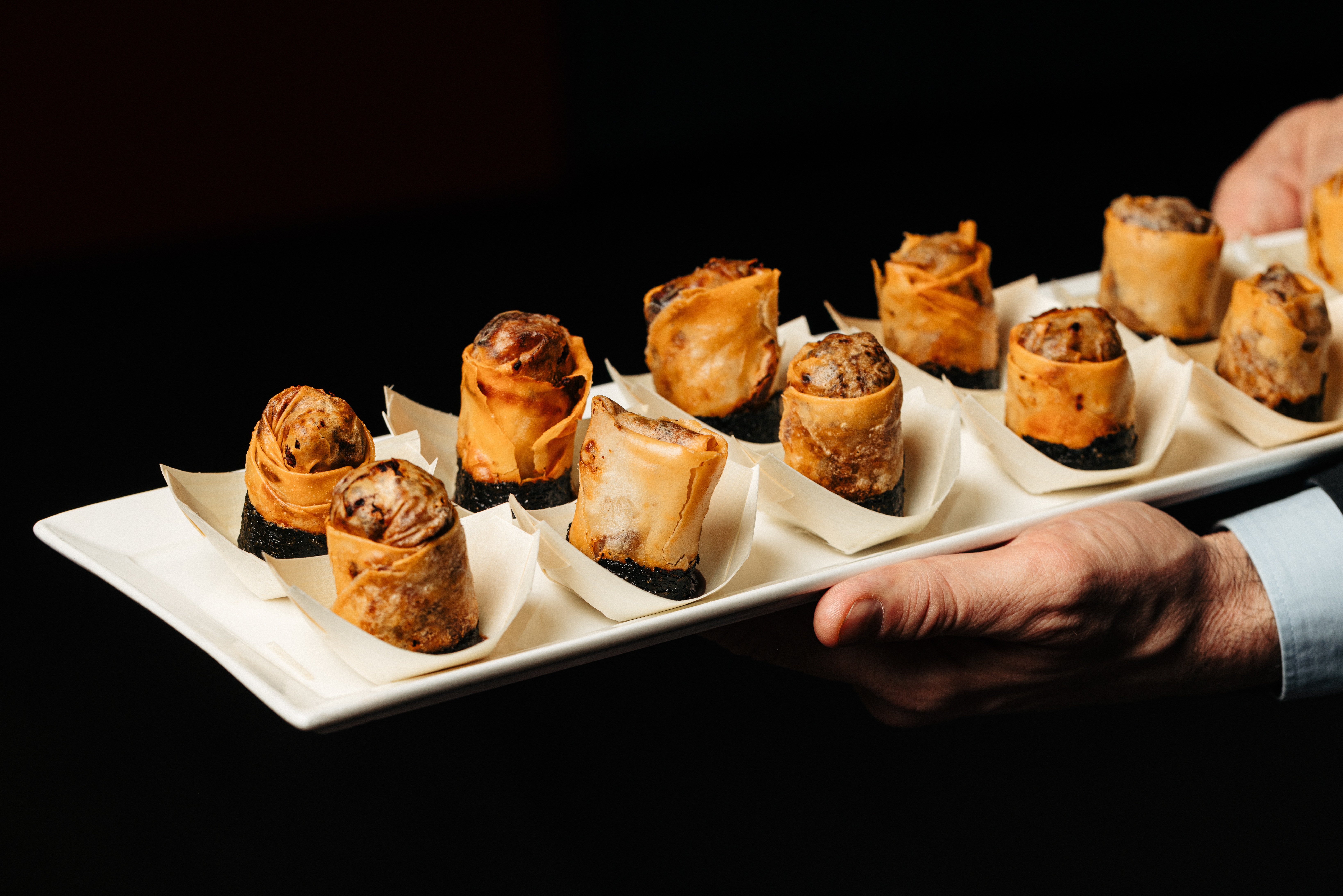 Elegant Asian-inspired appetizer platter for networking events at Chino Latino, London.