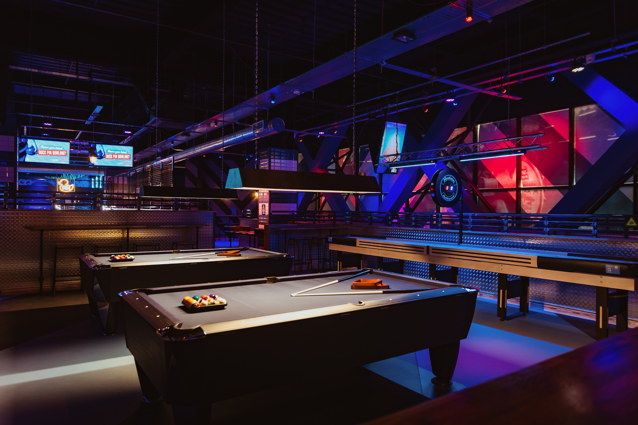 Full Venue Hire at Roxy Lanes Cardiff: vibrant event space with pool tables for gatherings.