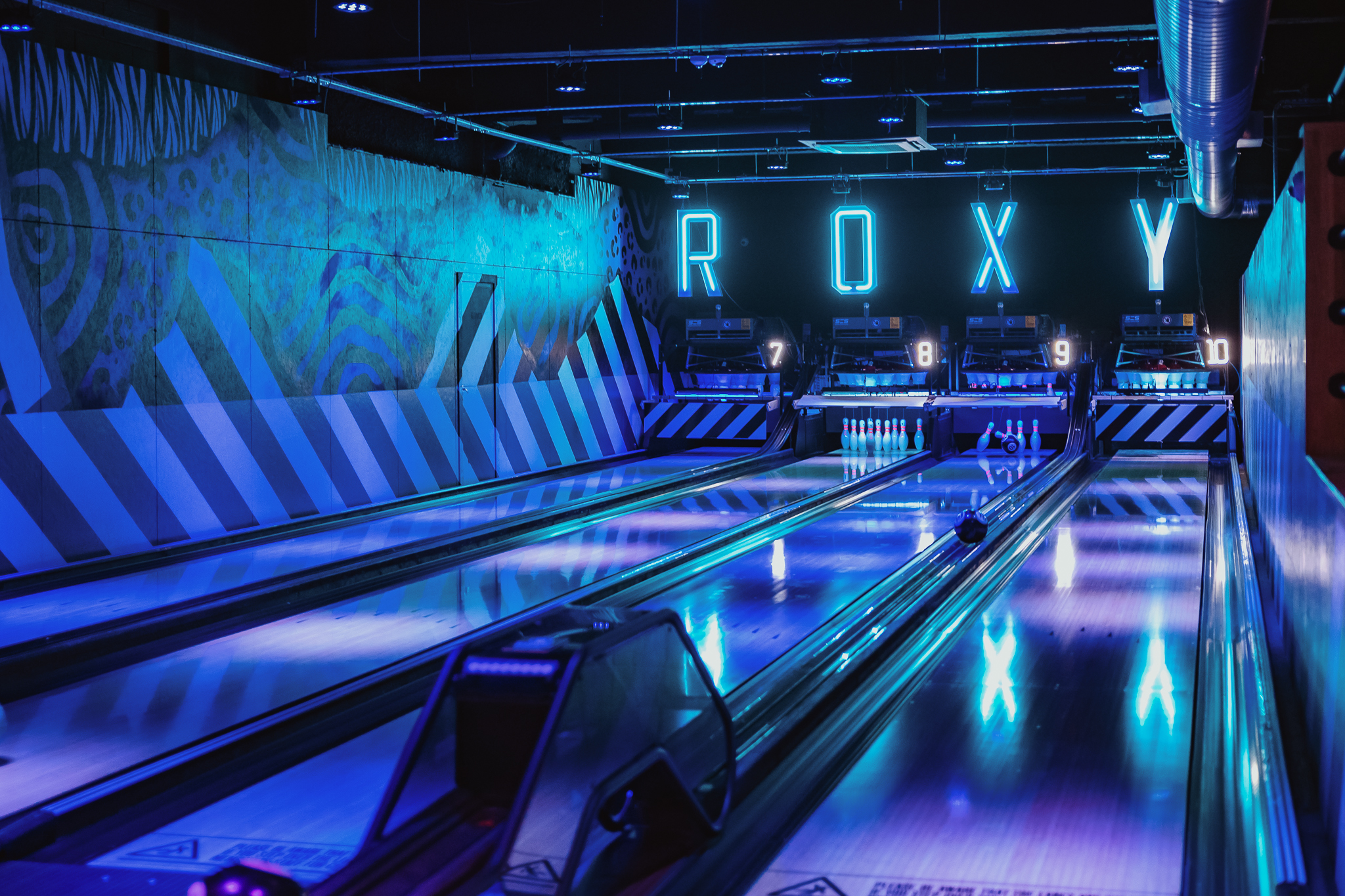 Vibrant bowling alley at Roxy Lanes, Cardiff for team-building events and corporate parties.