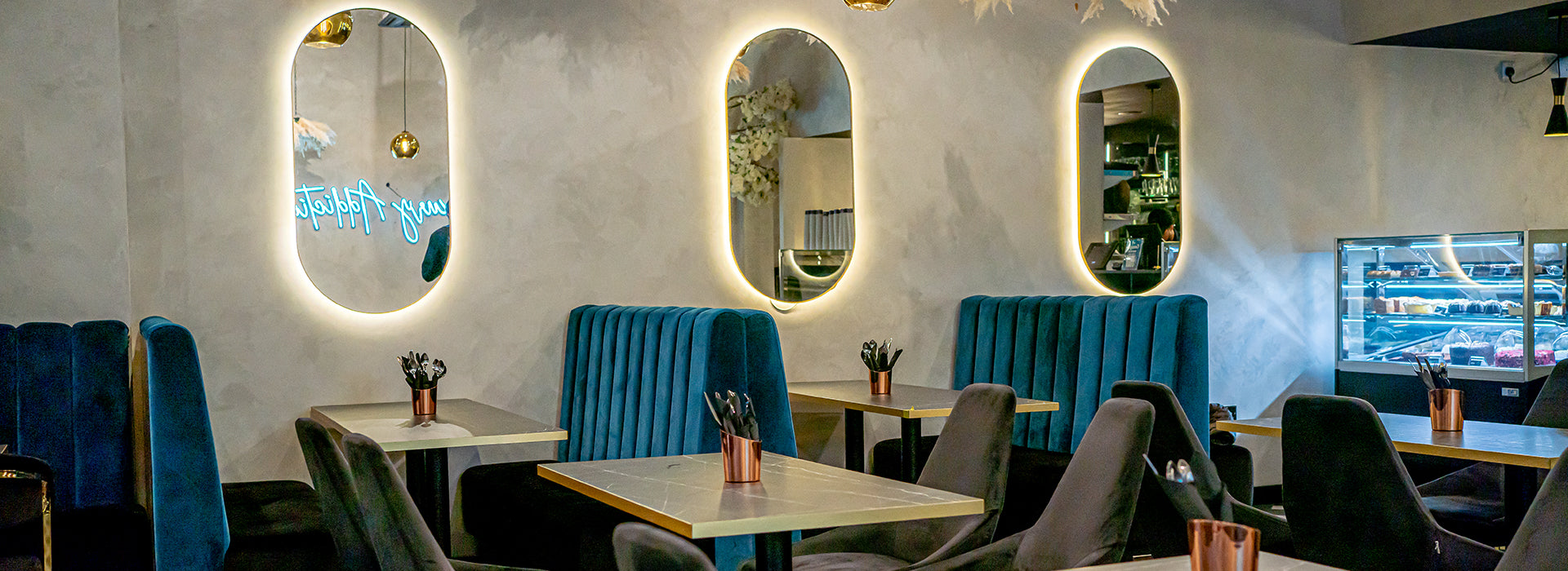 Luxury dessert shop with velvet booths for high-end networking and corporate events.