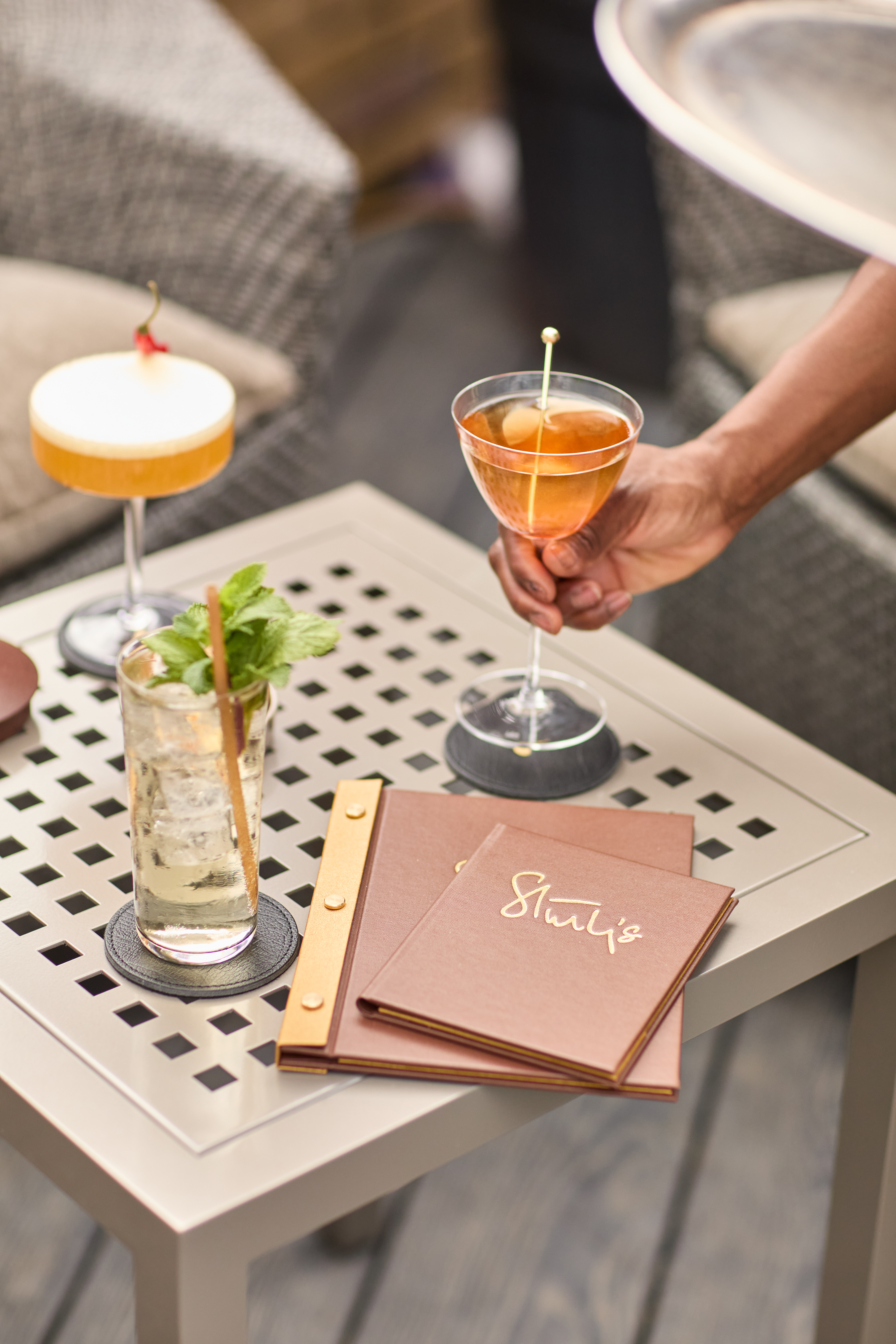 Stylish cocktail setup at Chesterfield Mayfair Hotel for upscale networking event.
