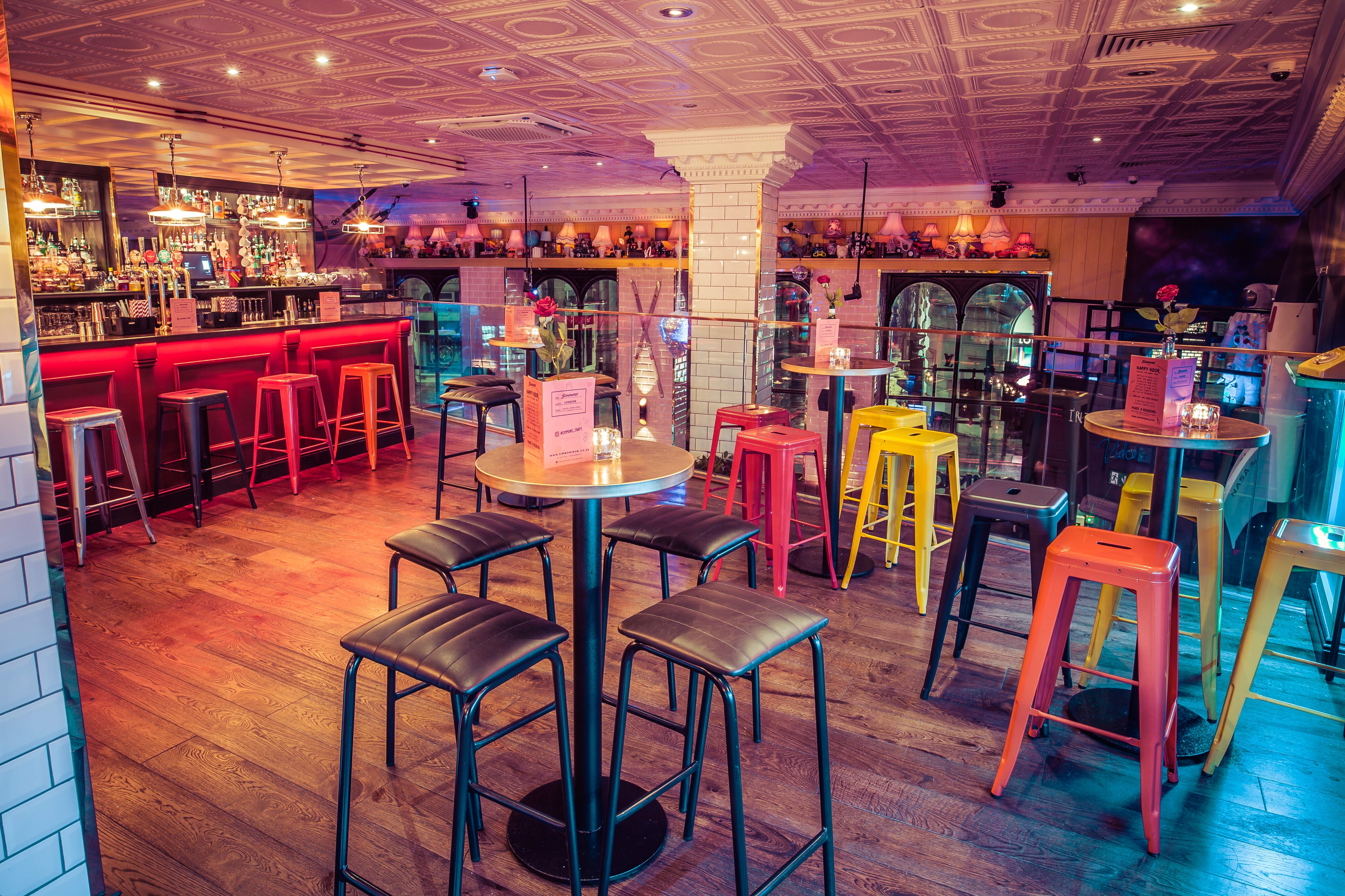 Vibrant Mezzanine event space with stylish bar, perfect for cocktail receptions.