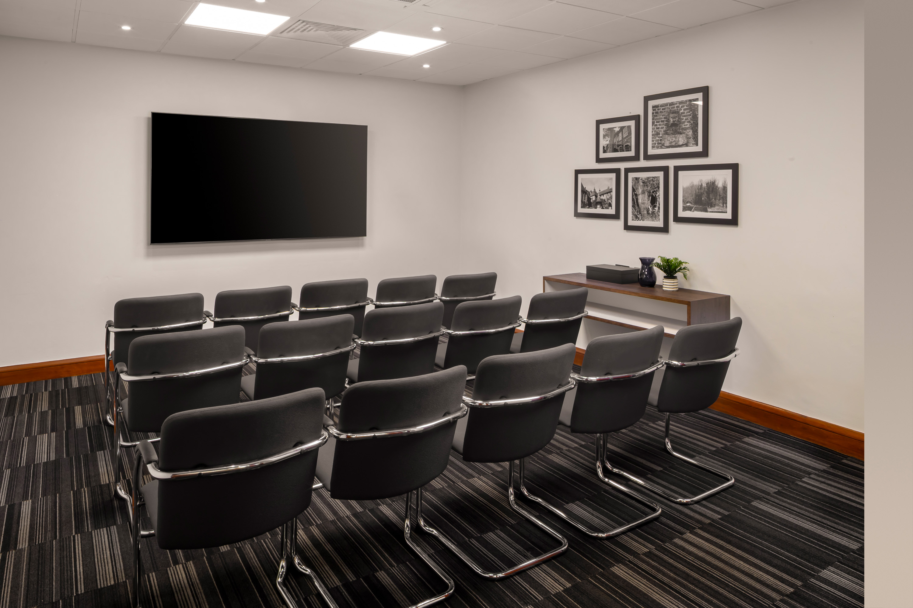 Meeting room at Holiday Inn Bexley with modern seating for workshops and seminars.