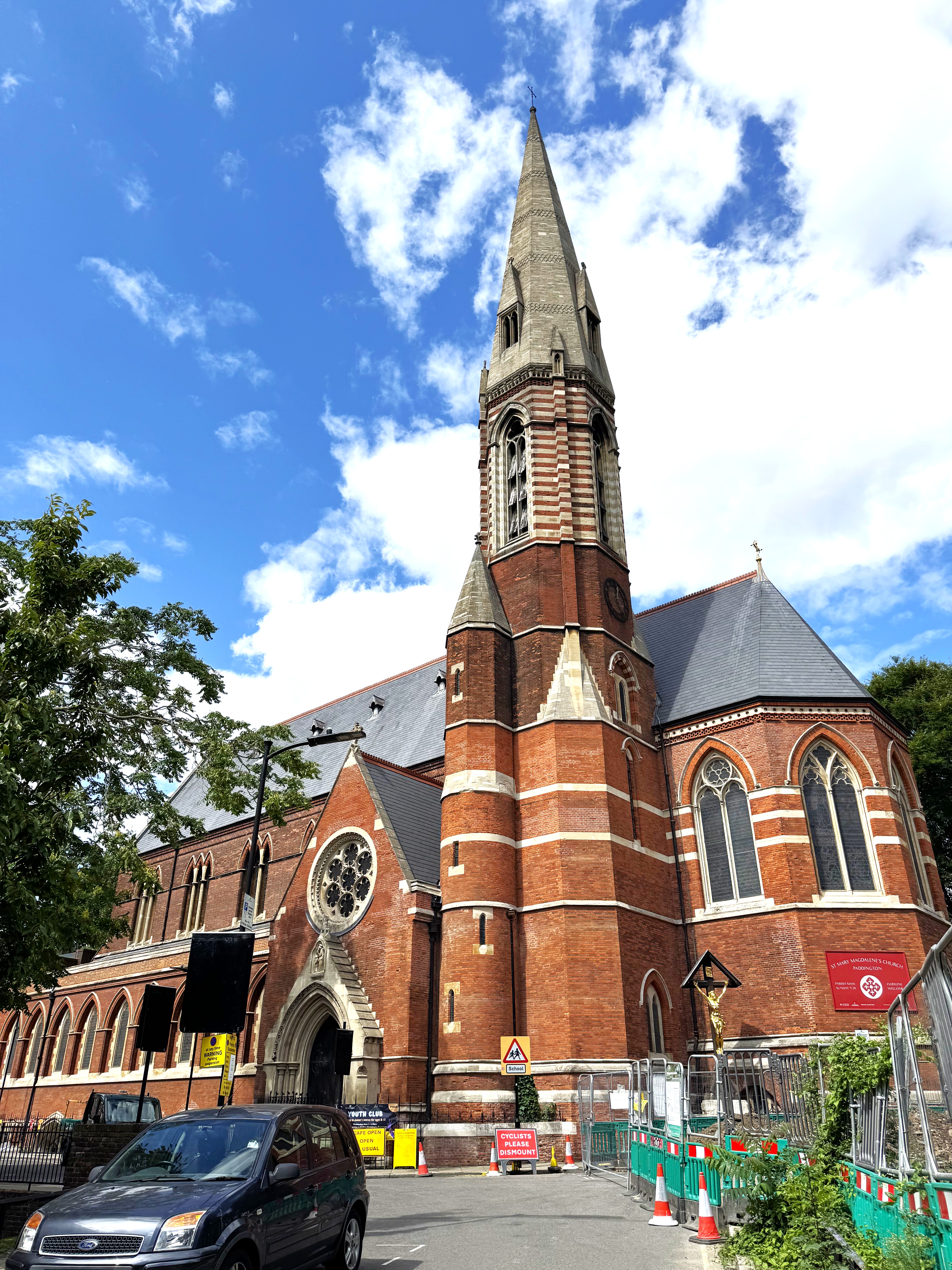 Exclusive Venue Hire at St Mary Magdalene's: brick church with tall steeple for weddings.