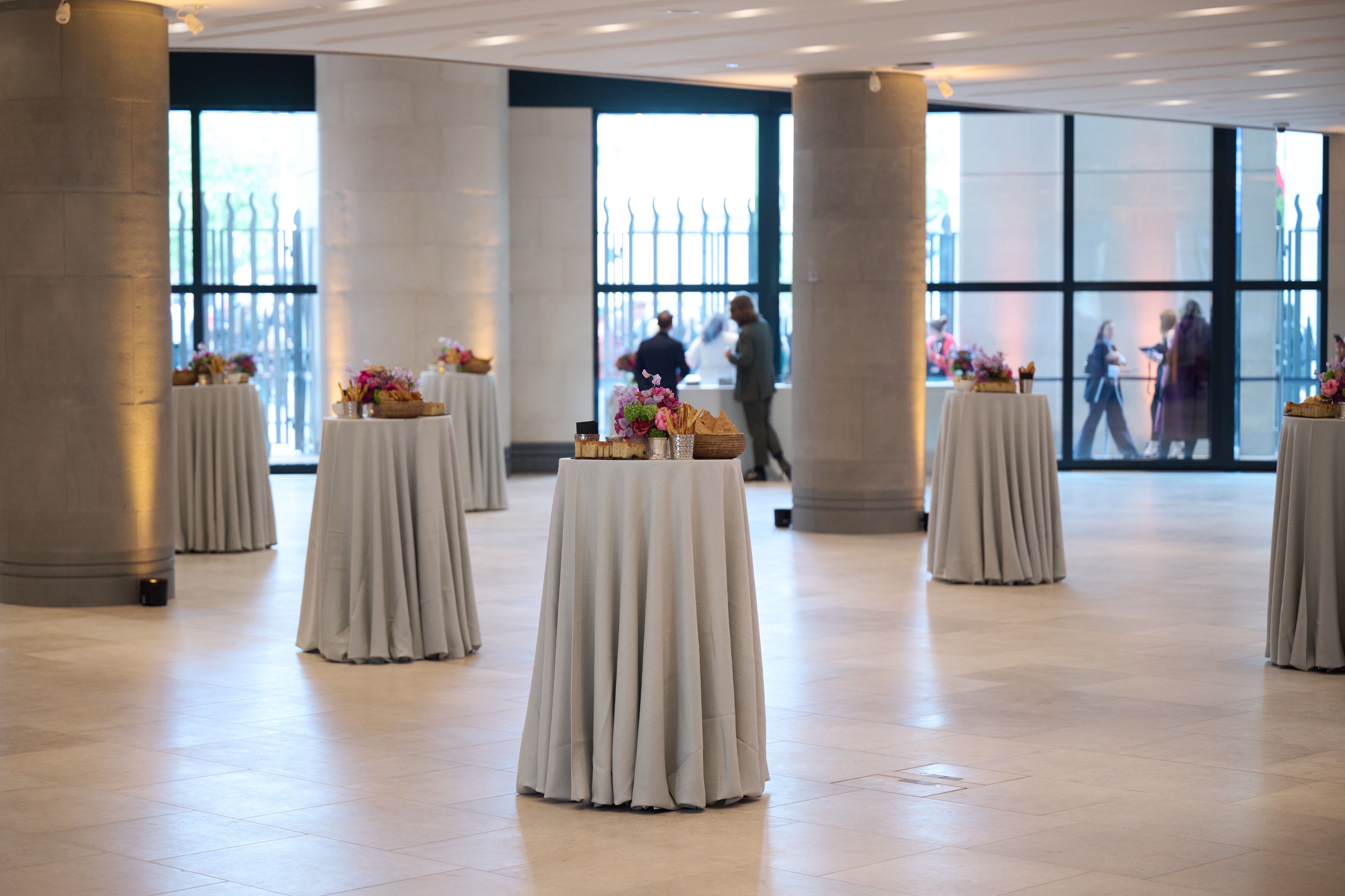 Sainsbury Wing Foyer with cocktail tables, ideal for networking events and receptions.