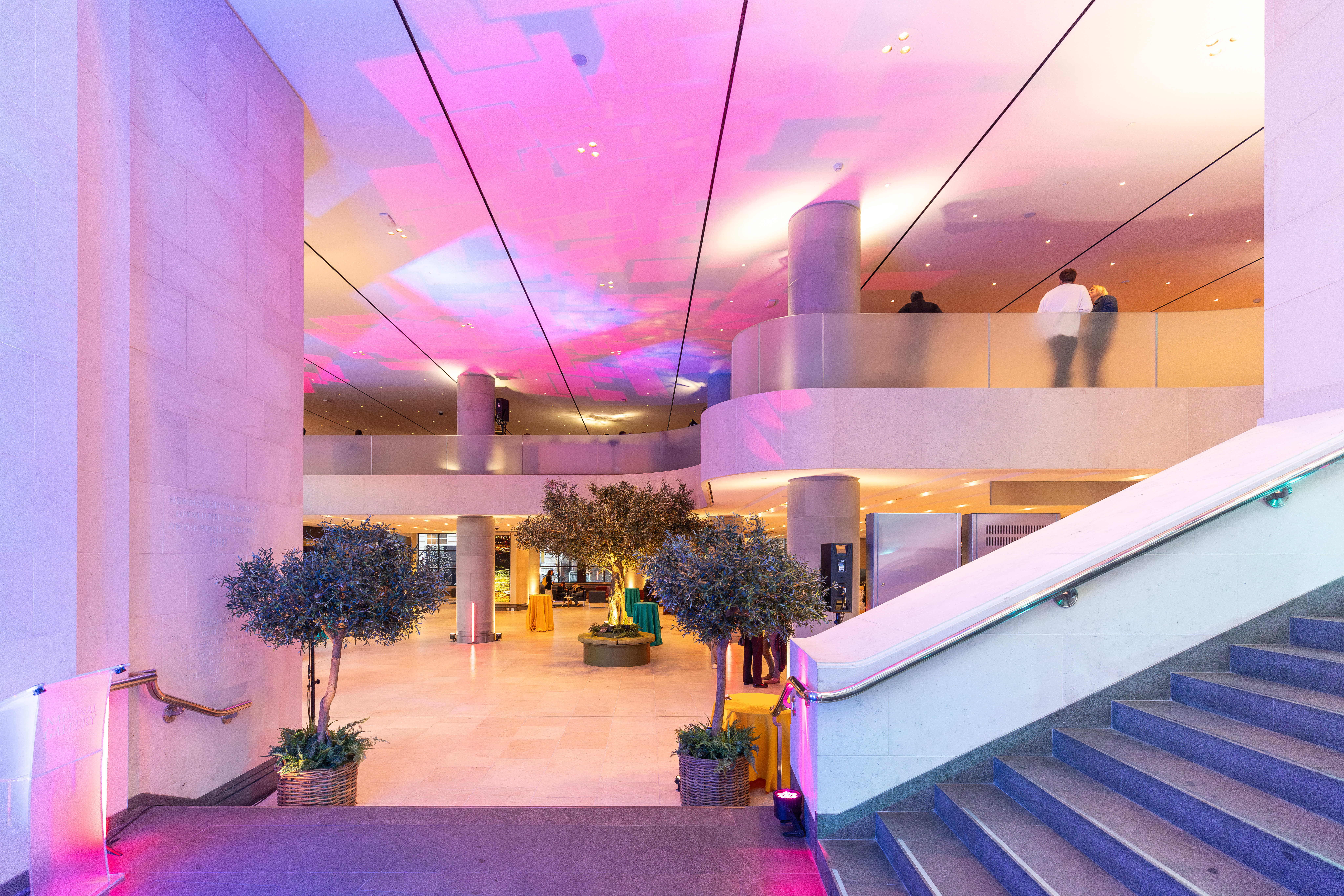 Sainsbury Wing Foyer, modern meeting space with greenery, perfect for professional events.