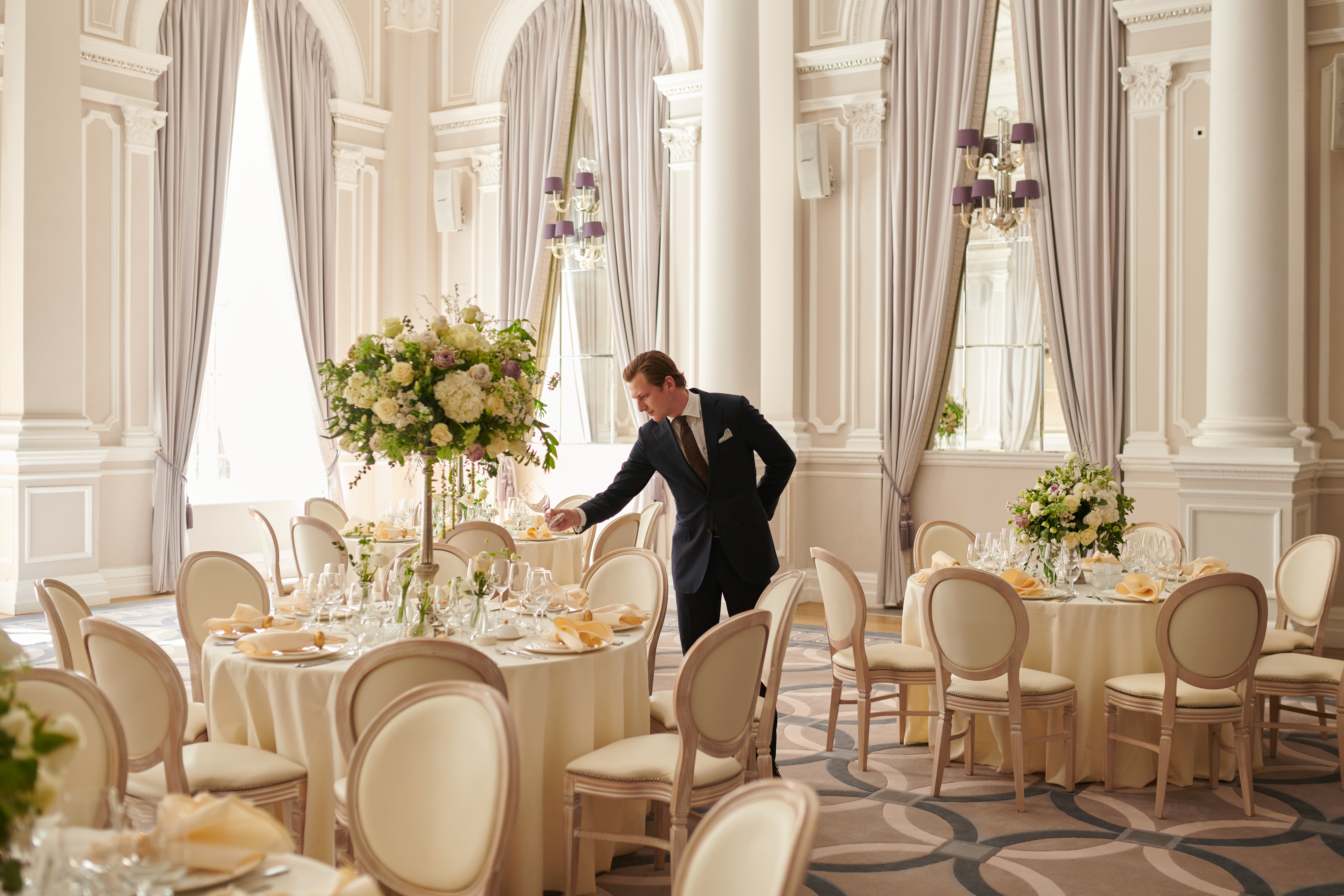 Sophisticated wedding venue at Corinthia London with elegant decor and floral arrangements.