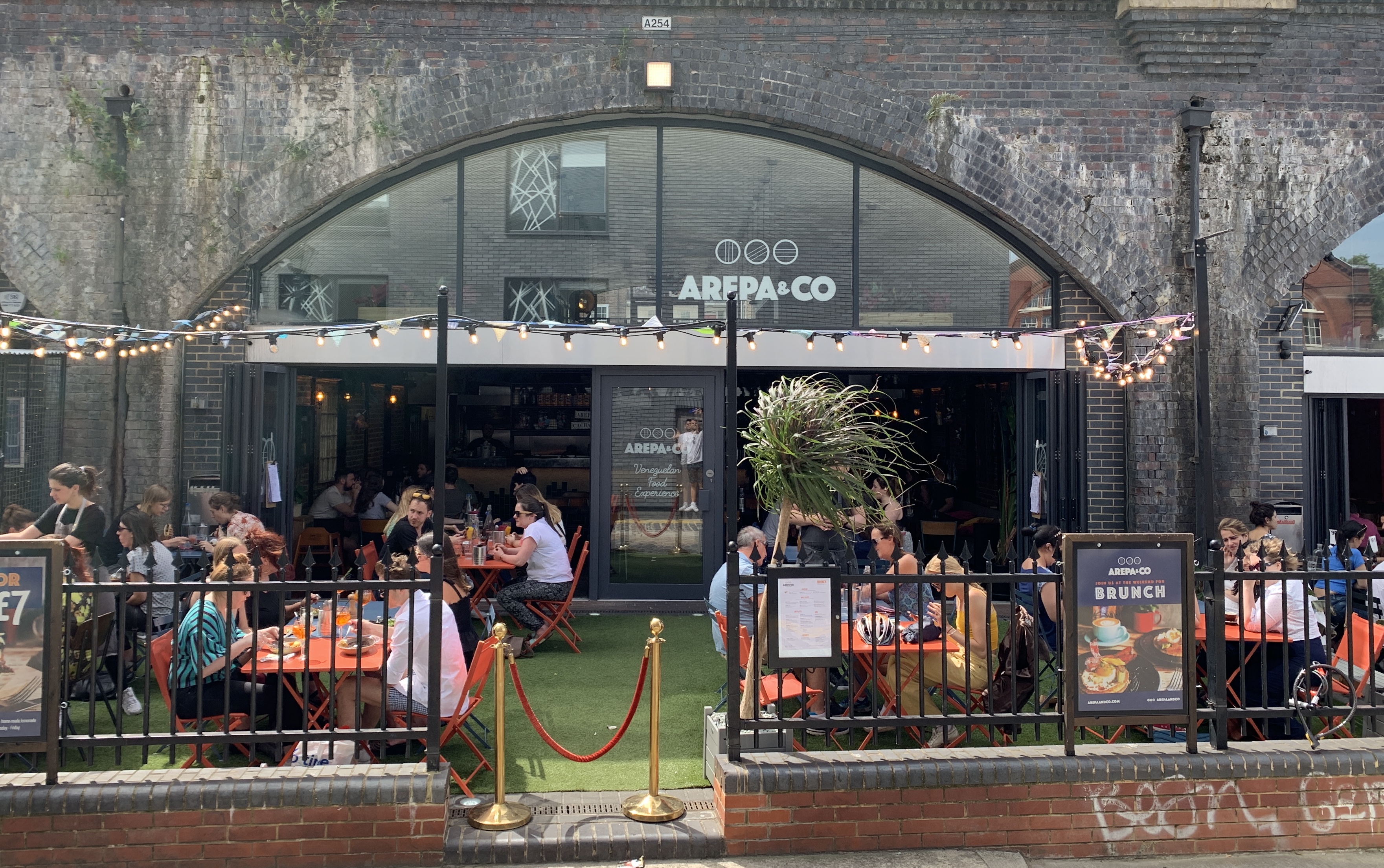 Vibrant outdoor terrace at Arepa & Co for corporate events and team-building gatherings.