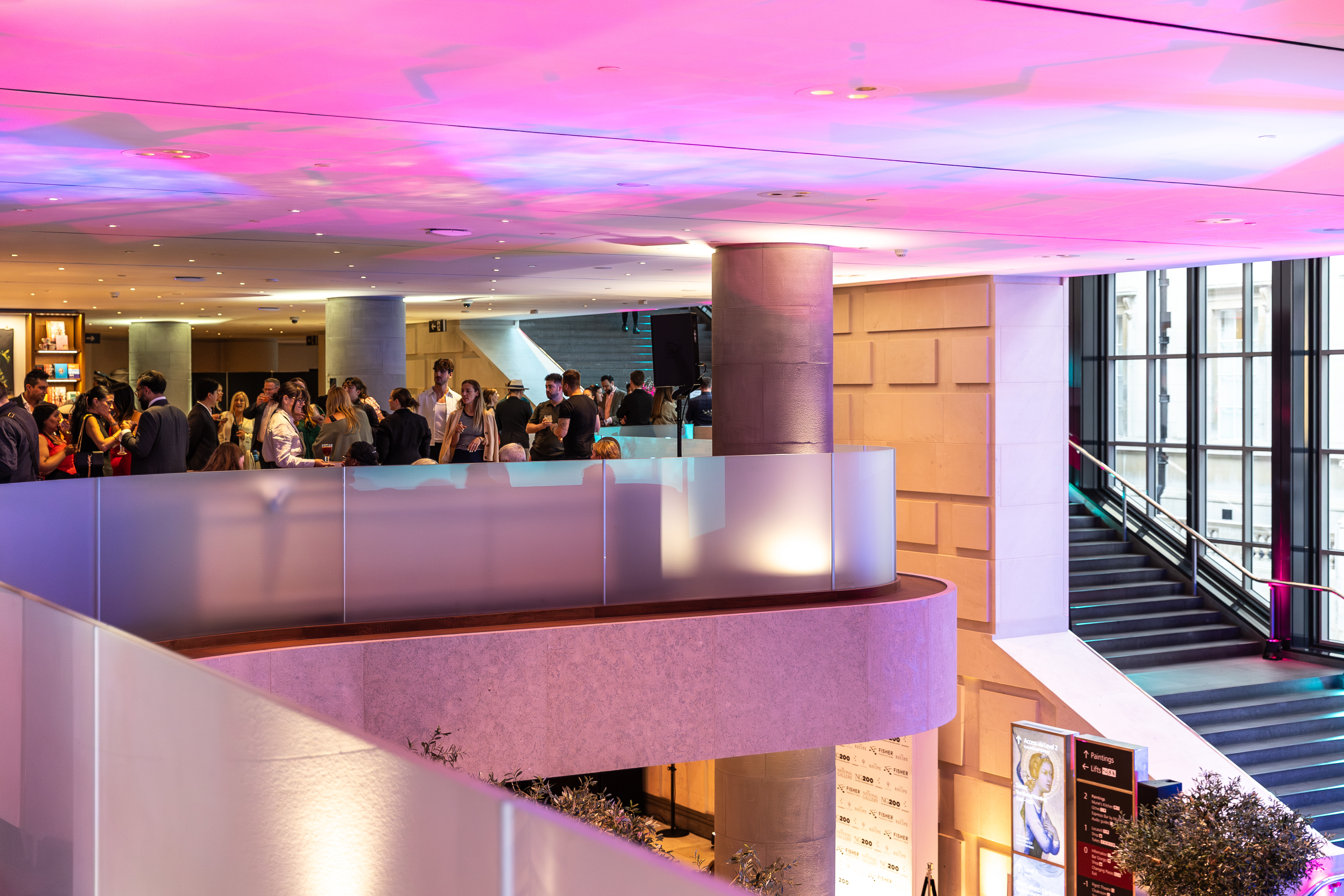 Elegant event space at The National Gallery with colorful lighting for networking and conferences.