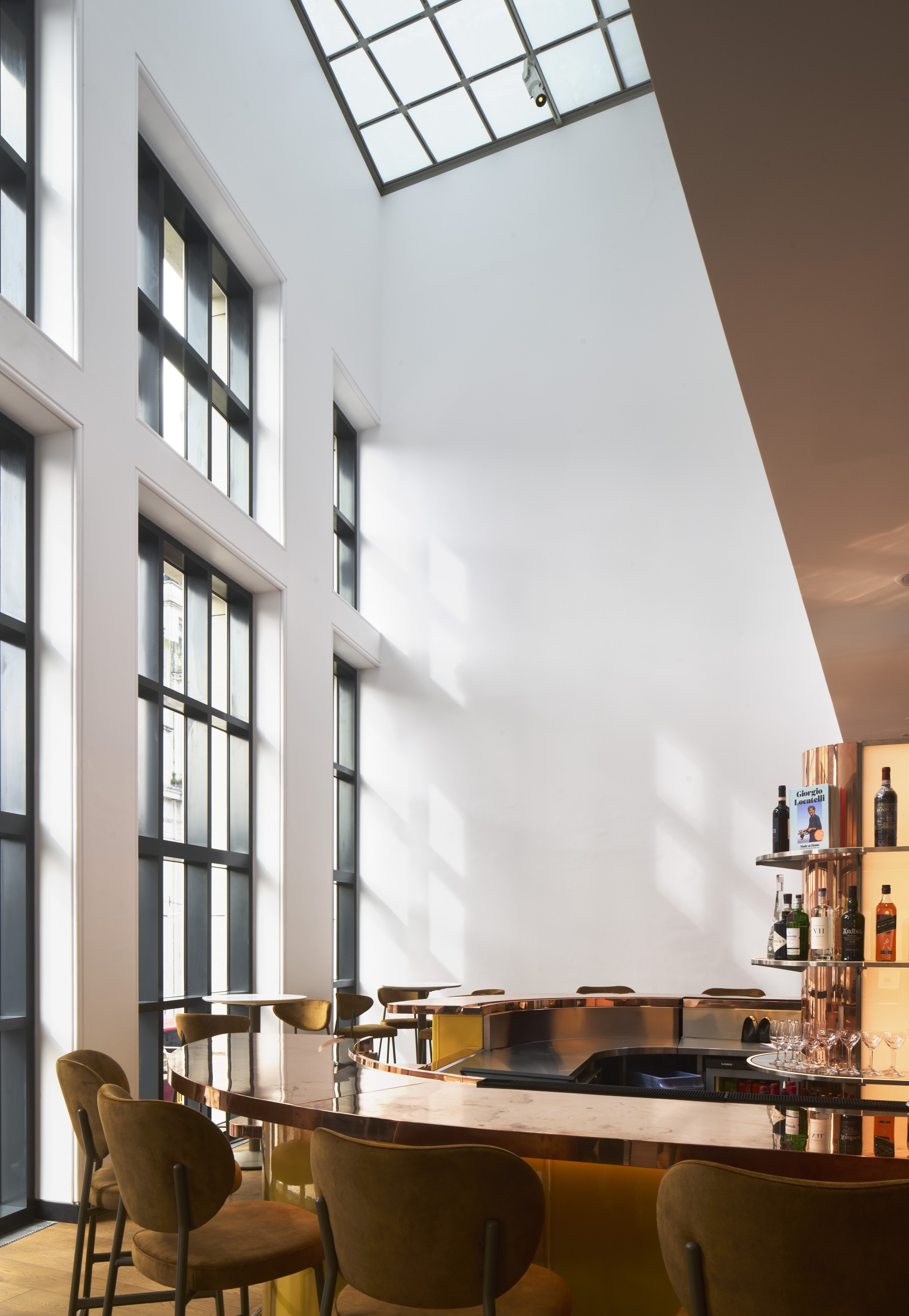 Bright modern gallery with large windows, ideal for corporate networking events.