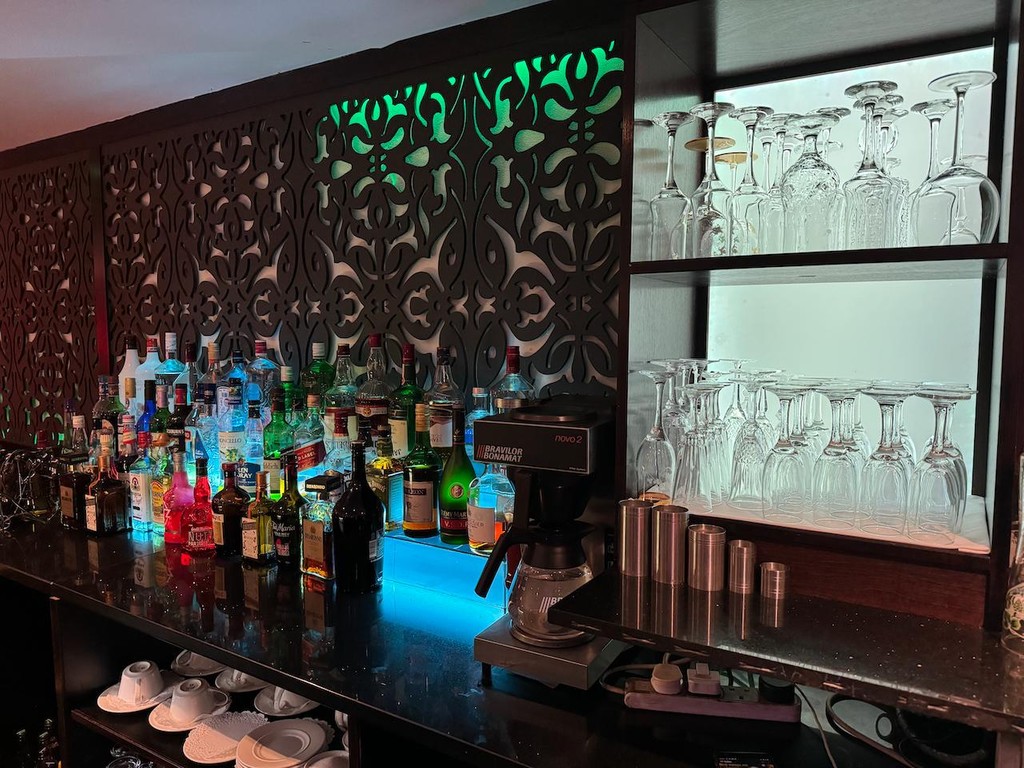 Illuminated bar at Spice Lounge Datchet, ideal for cocktail receptions and networking events.