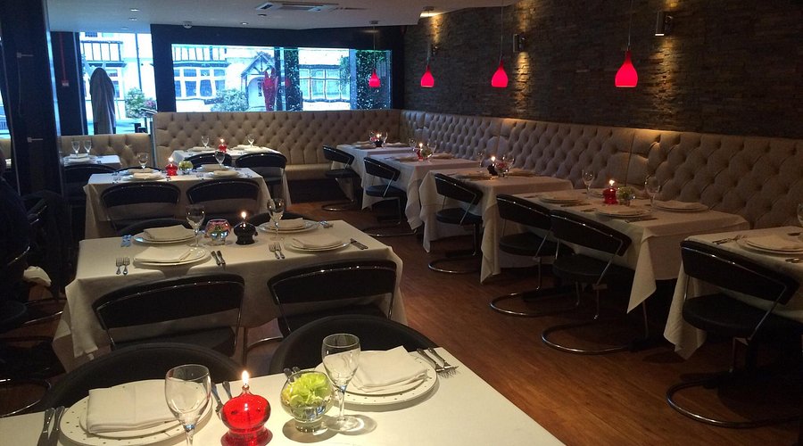 Upscale Datchet Spice Lounge restaurant with elegant banquette seating for private dining events.