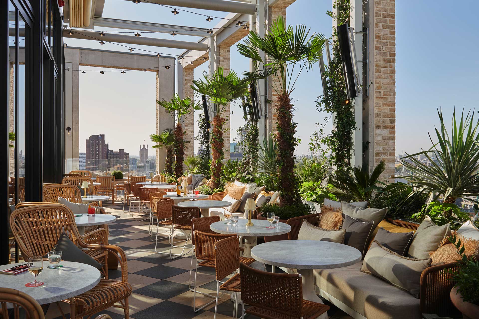 Stylish rooftop venue with greenery, perfect for social events and gatherings.