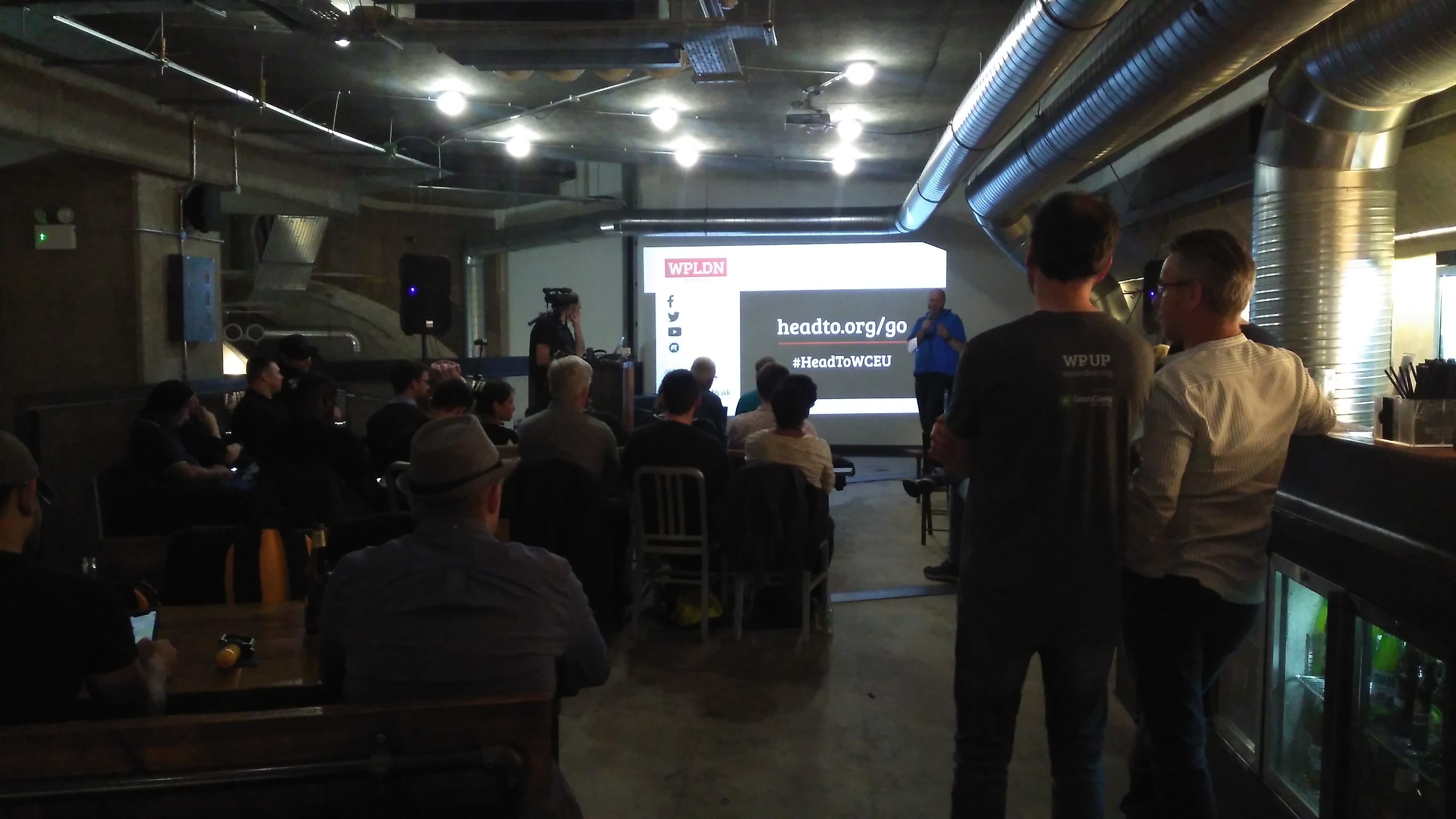 Engaged audience at Mamuśka! for a networking event in a modern venue.