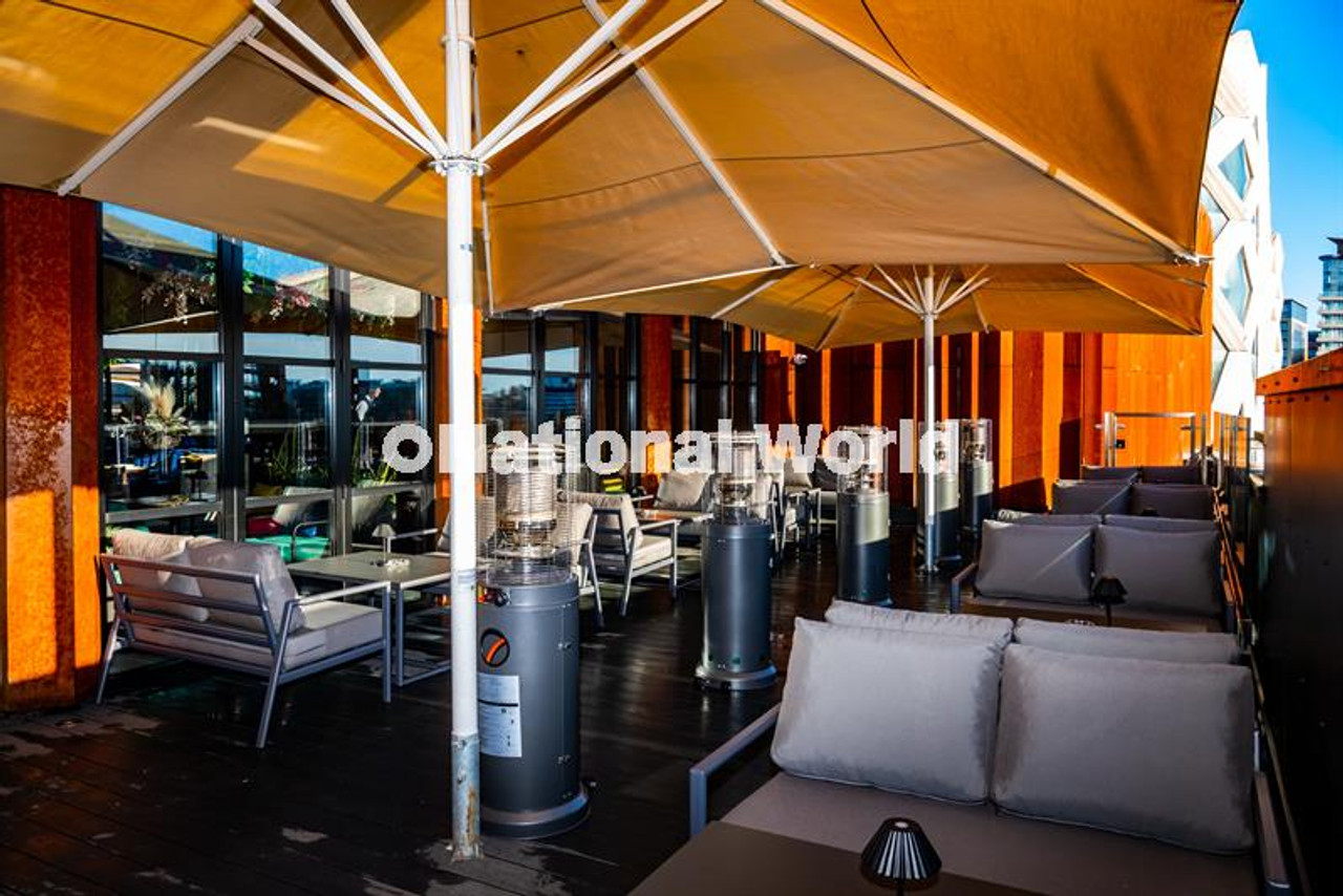 Rooftop lounge with heaters for intimate networking and corporate event breakout spaces.