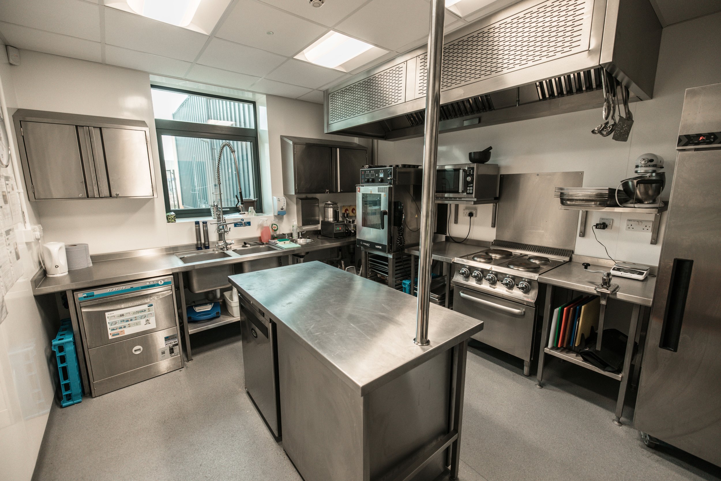 Compact catering kitchen for small-scale events and food service preparation.