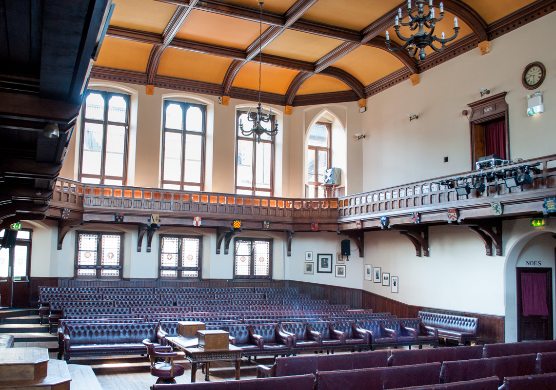 Cambridge Union Debating Chamber with tiered seating, ideal for conferences and discussions.