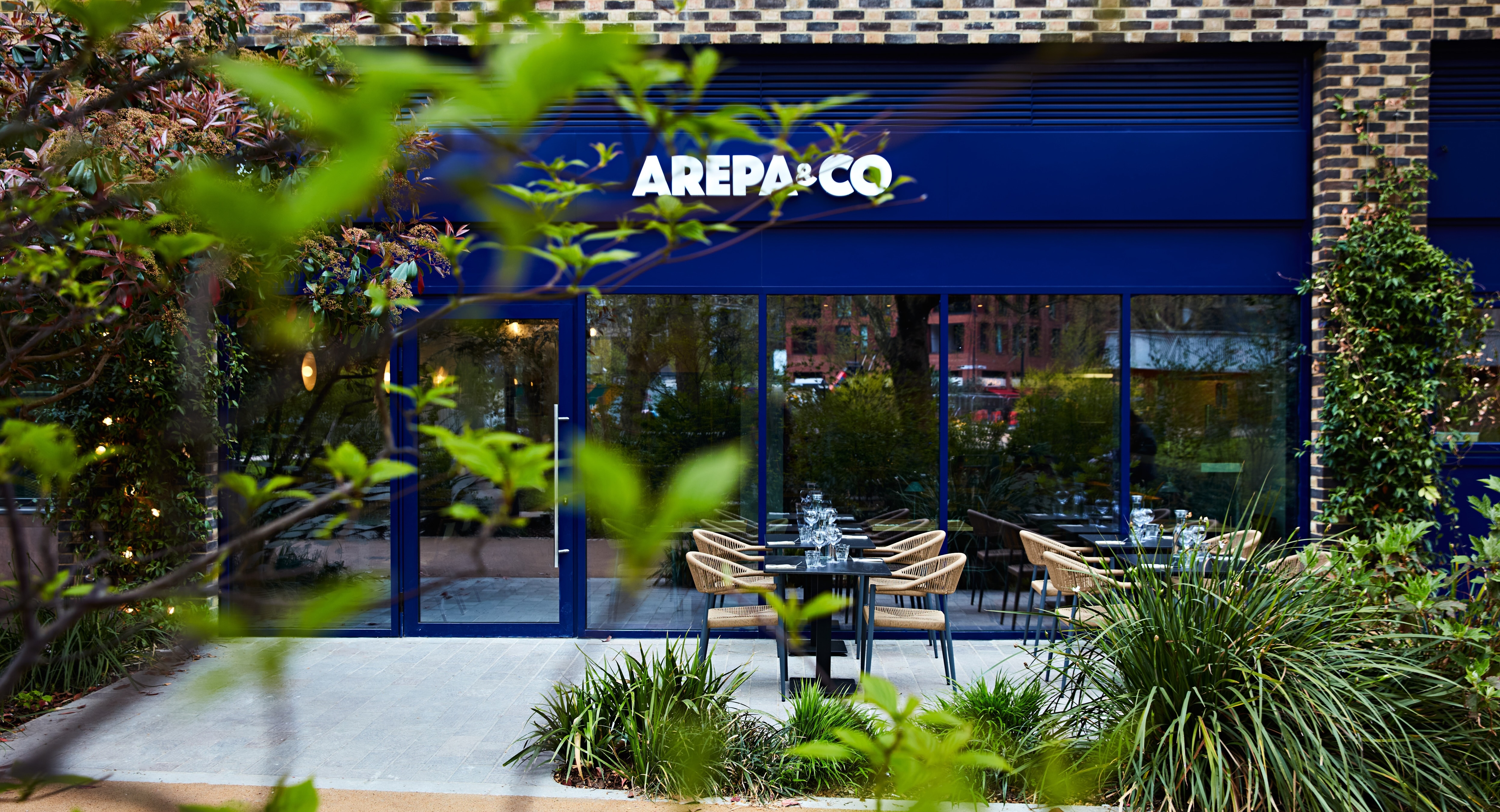 Modern Arepa & Co restaurant with outdoor seating for events in Elephant Park.