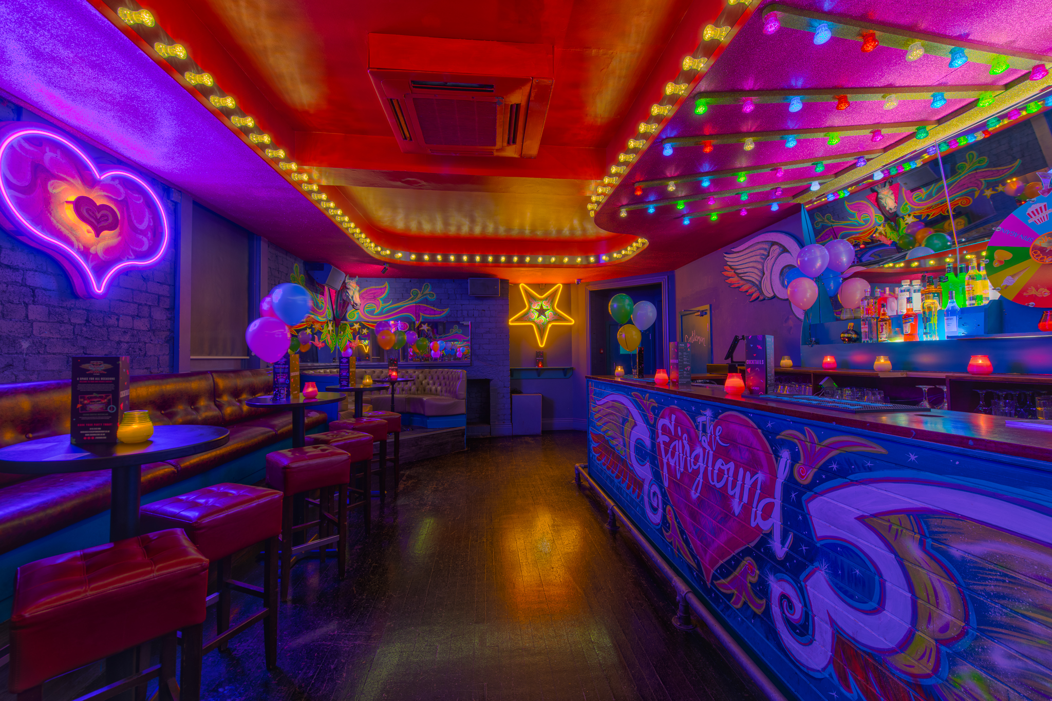 Vibrant Fairground 2 venue with colorful lighting, ideal for social events and gatherings.