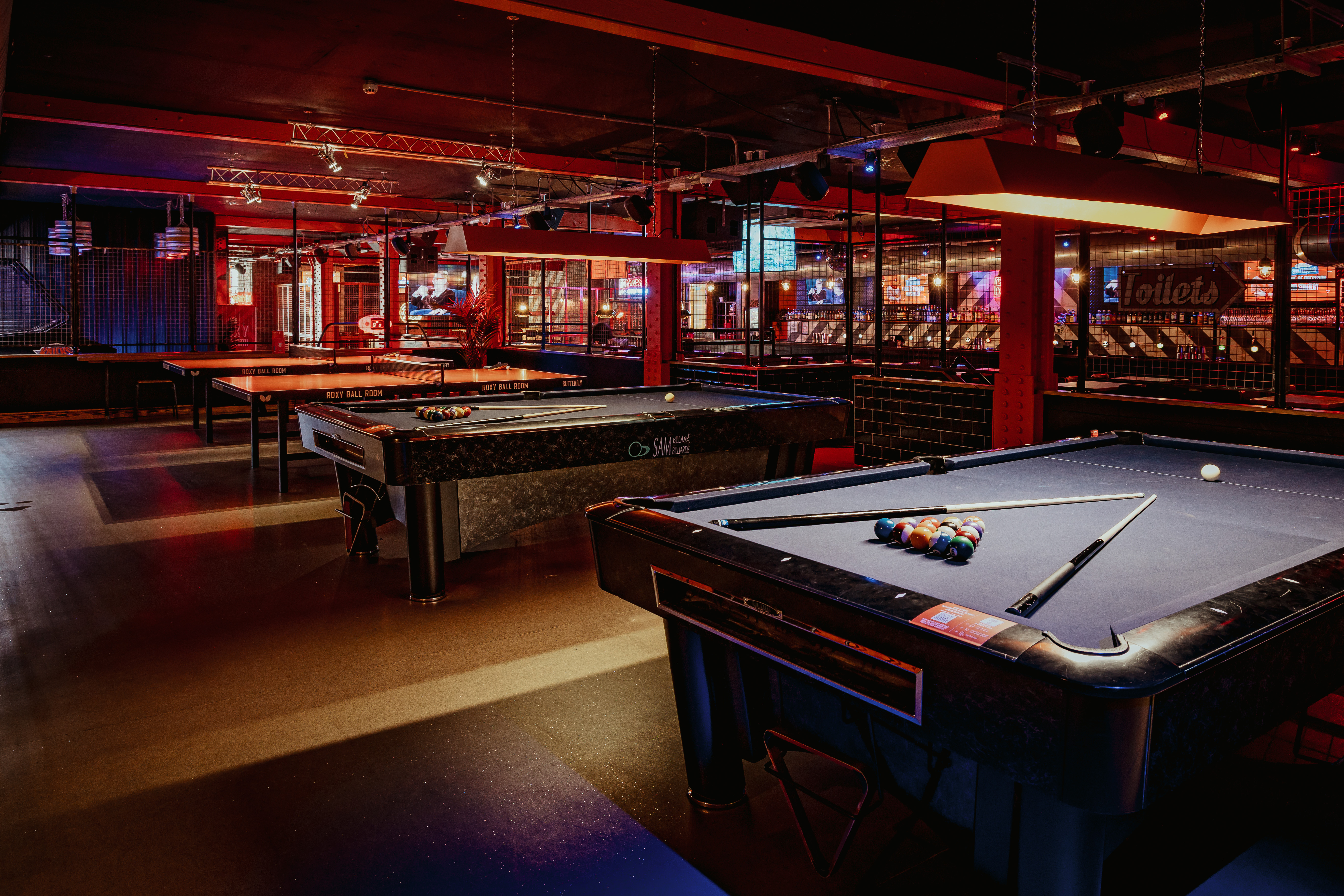 Full venue hire at Roxy Ball Room, Deansgate: vibrant space with pool tables for networking events.