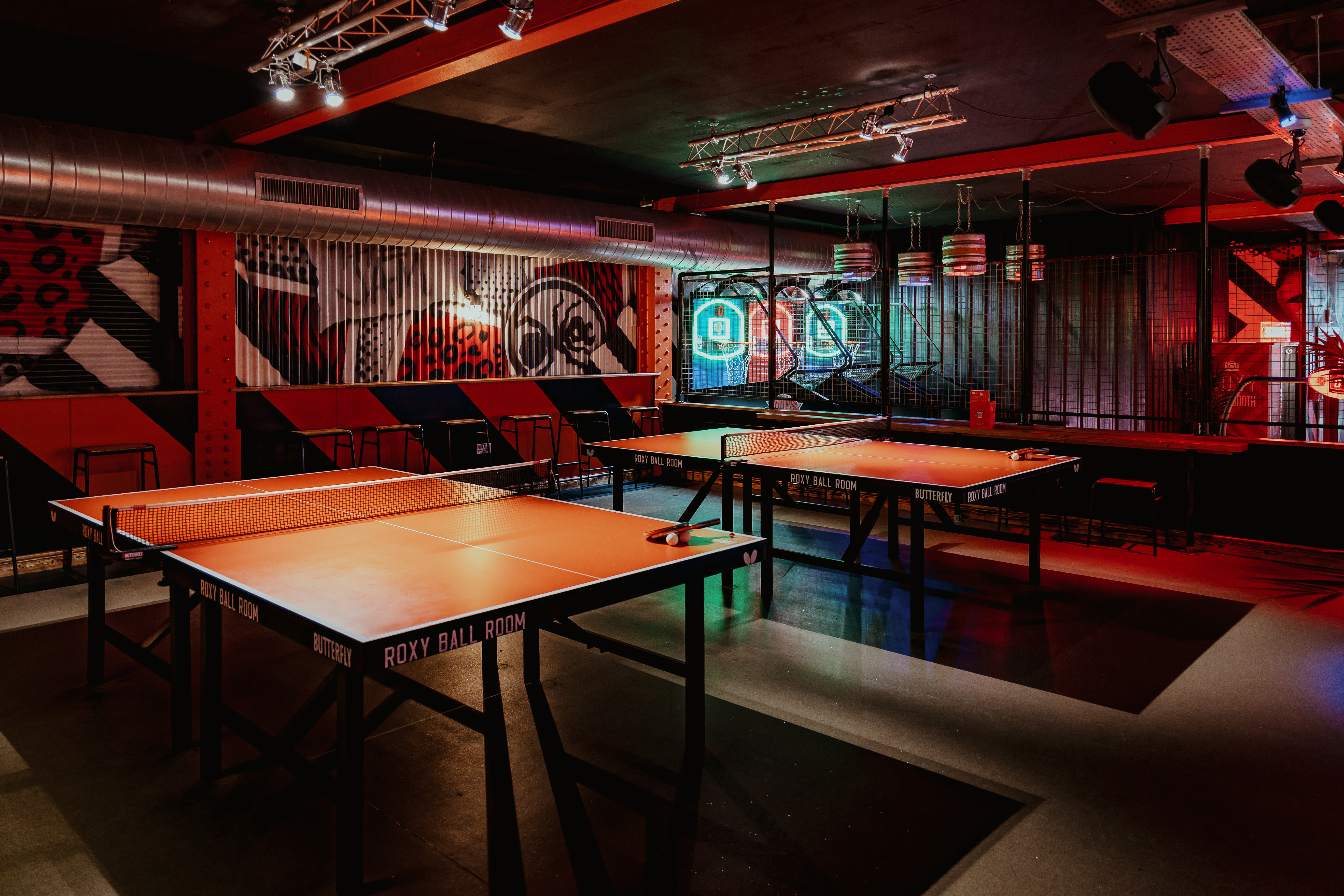 Vibrant Roxy Ball Room event space in Manchester with ping pong tables for networking.