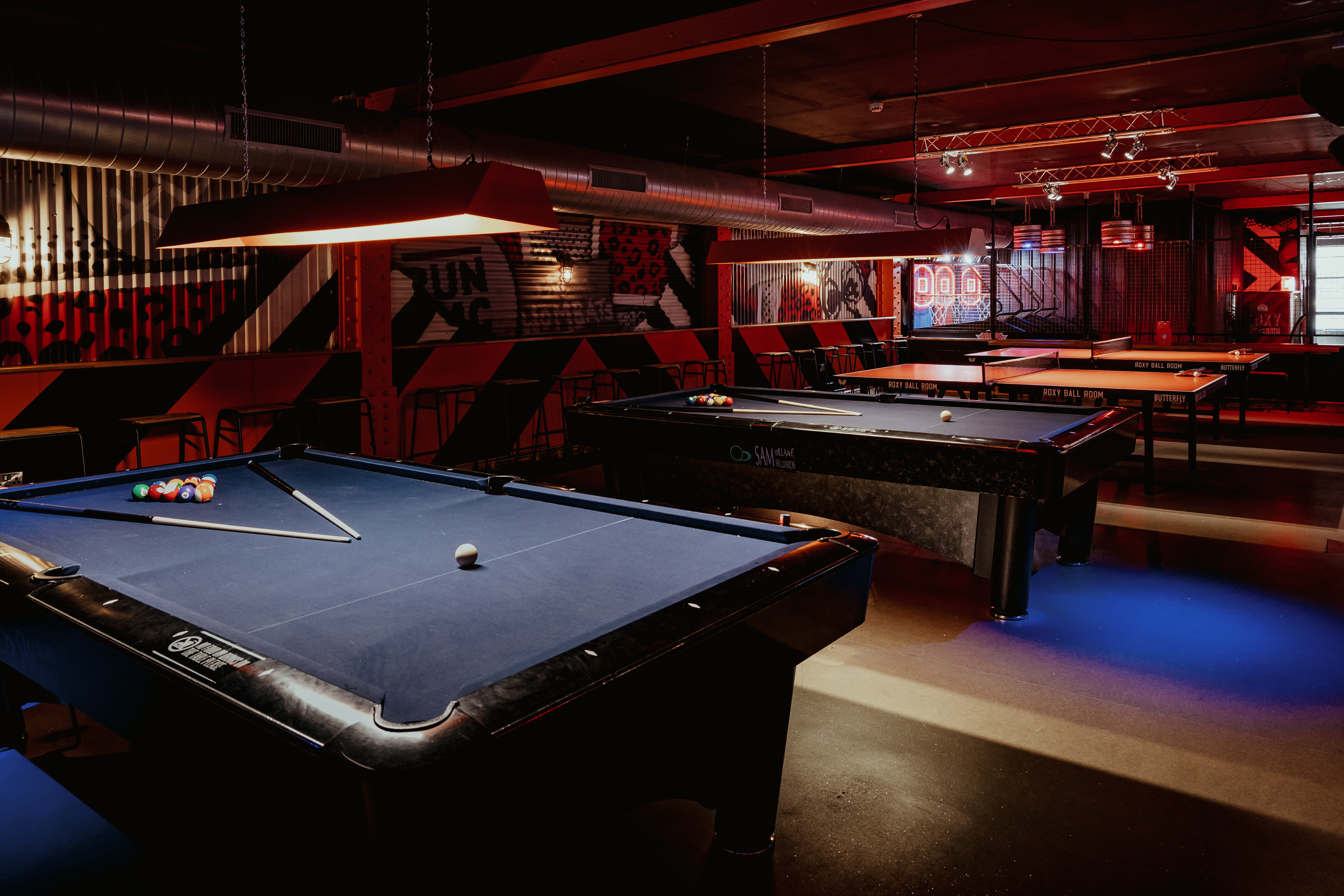 Vibrant Roxy Ball Room tournament area with pool tables for casual events in Manchester.