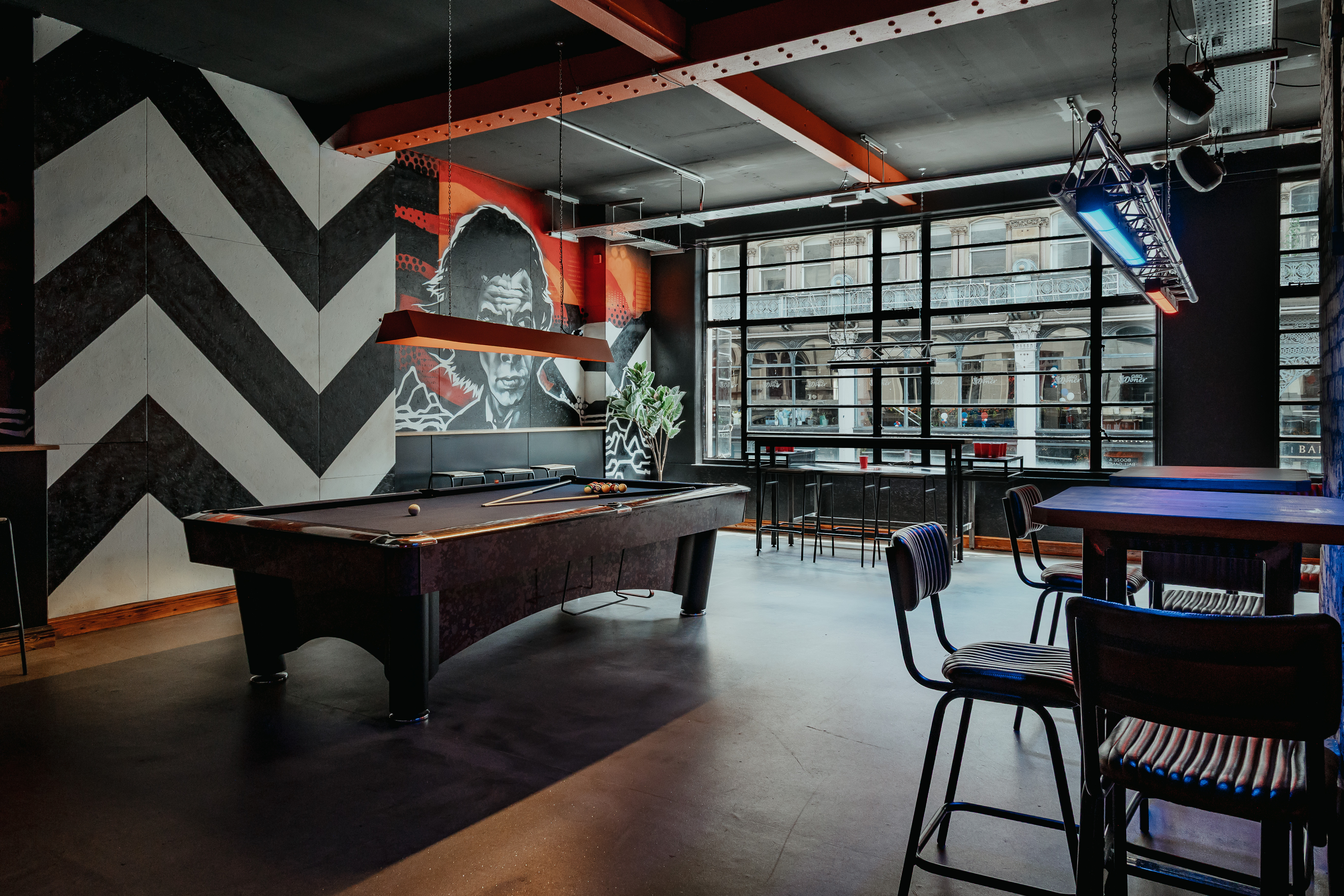 Modern event space at Roxy Ball Room with pool table, ideal for gatherings and meetings.