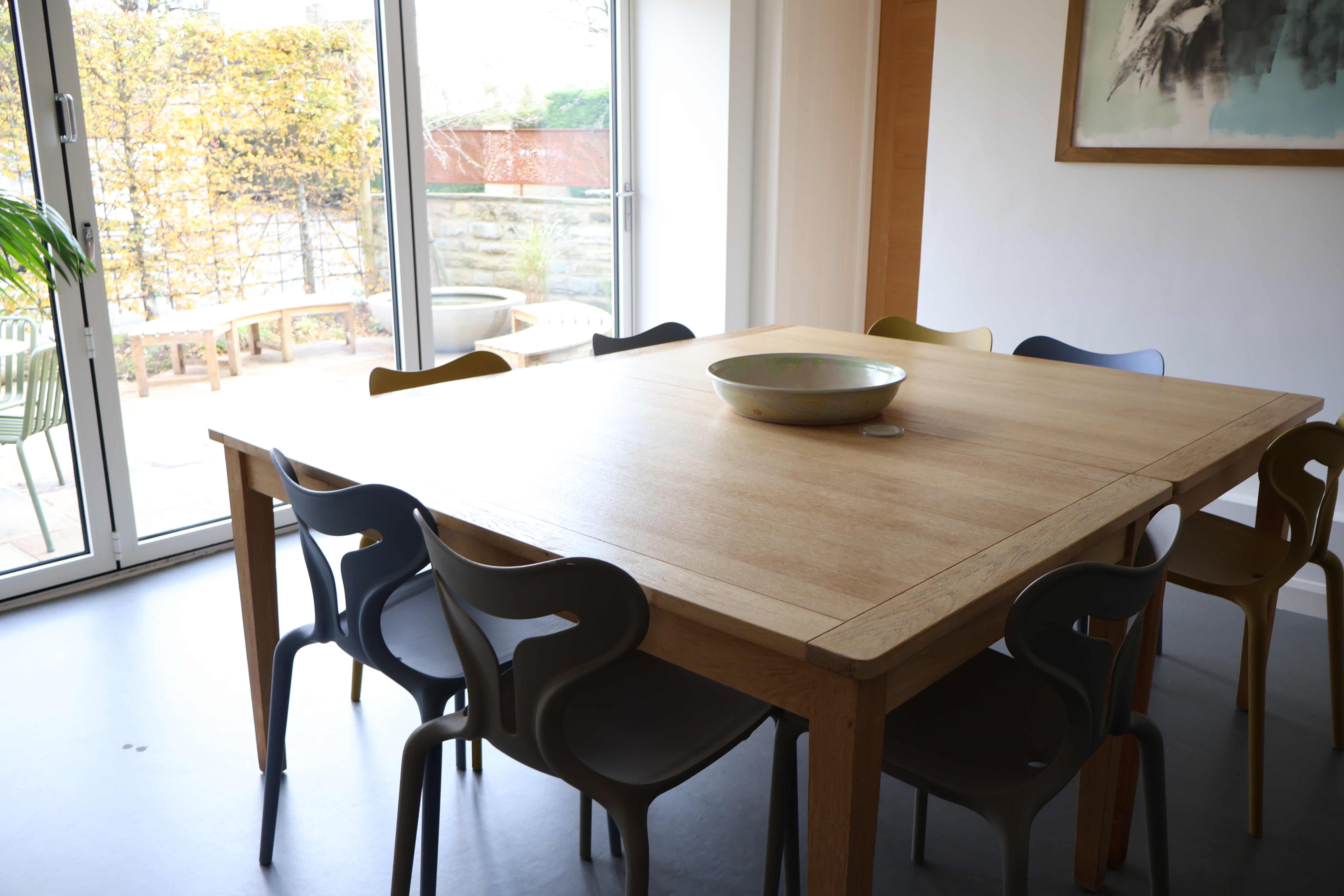 Oasis Studio meeting room with large table, ideal for creative events and workshops.